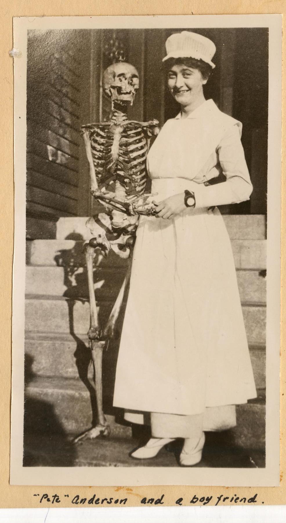 Image of Minor Private Hospital nursing student posing with skeleton, 1917