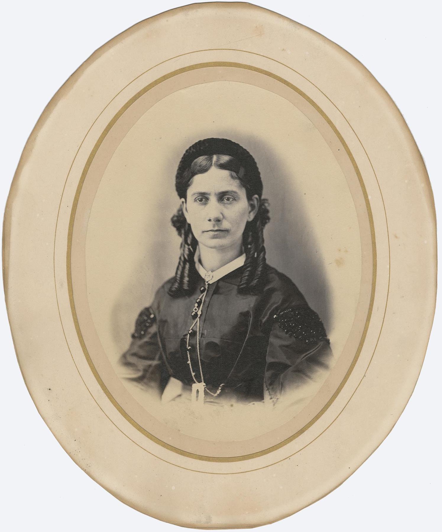 Image of Susan Maddocks posing in a studio, Seattle, circa 1875