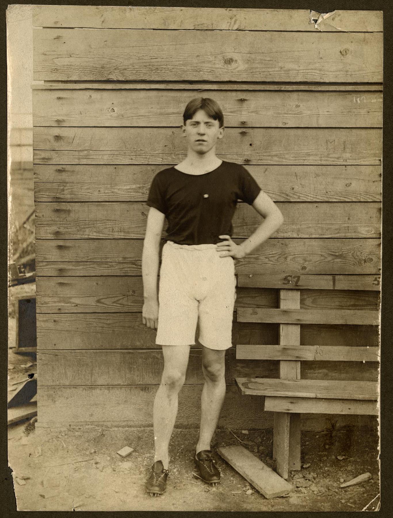 Image of Brick West posing at Seattle High School, 1905