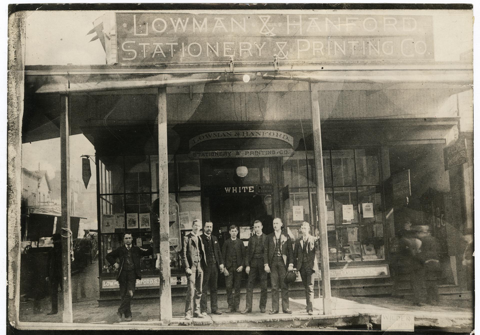 Image of Employees posing outside Lowman & Hanford Co. building on First and Cherry, Seattle, 1882