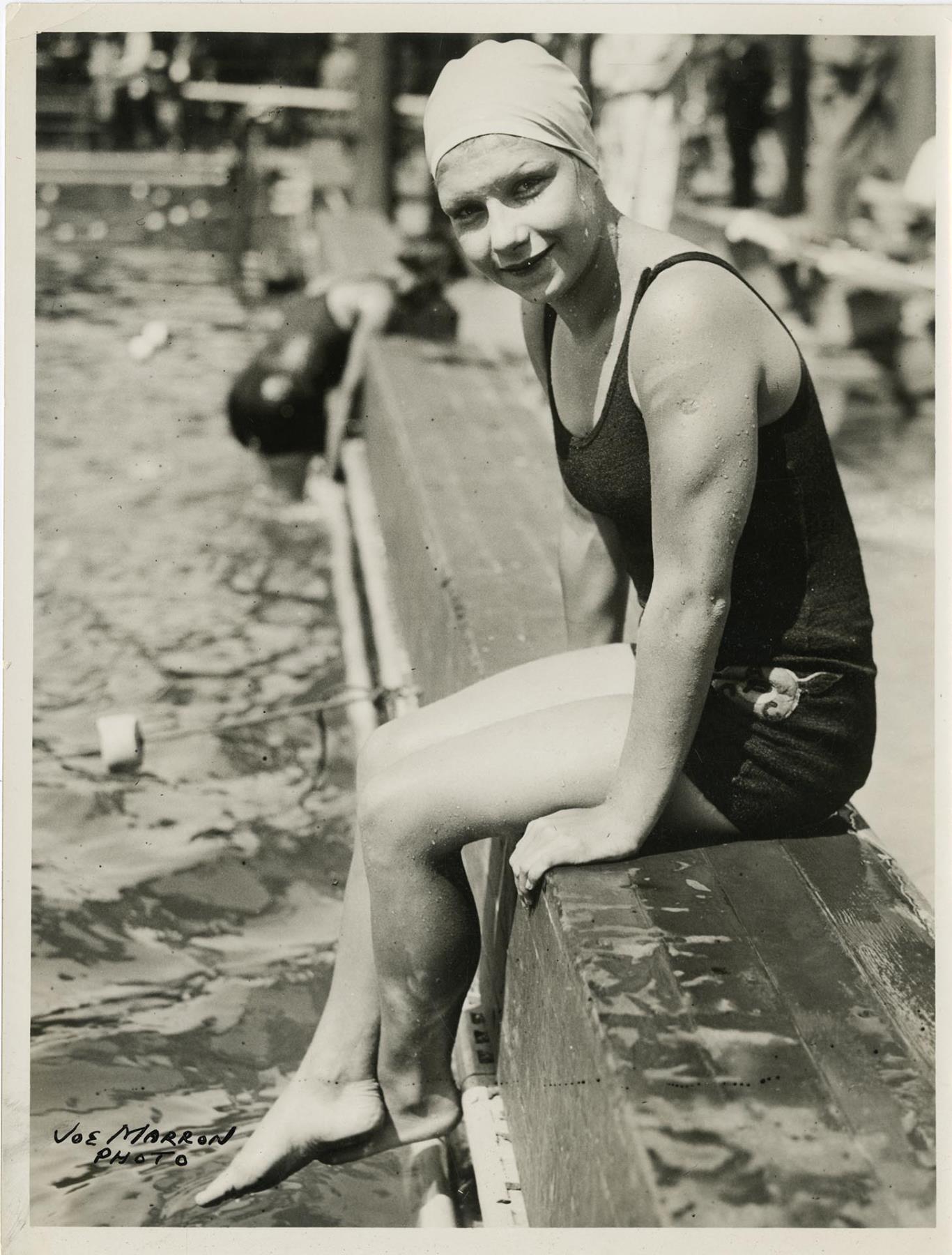 Image of Helene Madison seated at poolside, probably at Fleishhacker pool, San Francisco, September 1930