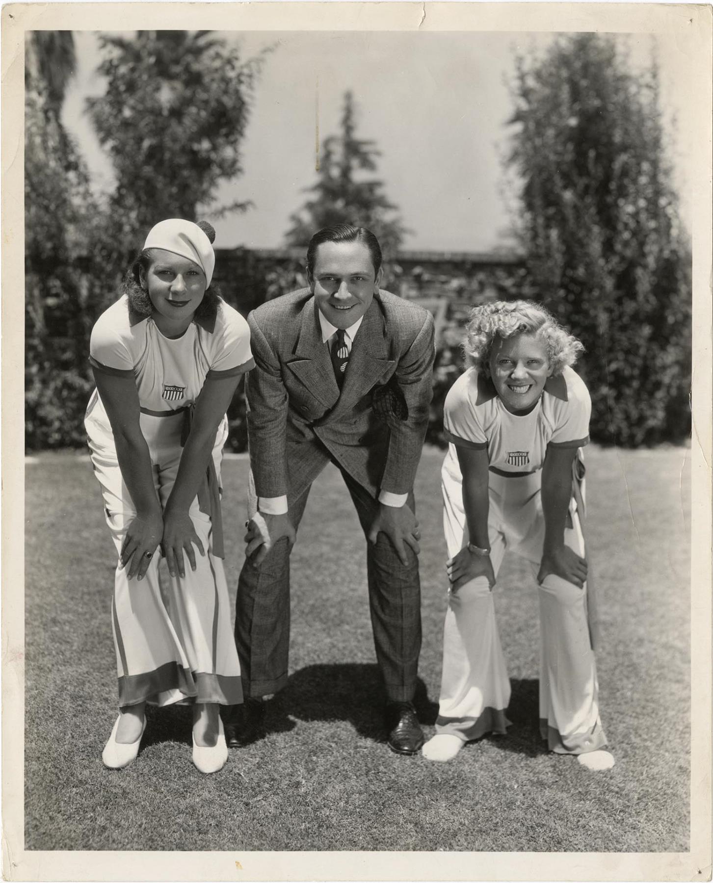 Image of Olympic swimmers Helene Madison and Georgia Coleman with Frederic March, Los Angeles, 1932