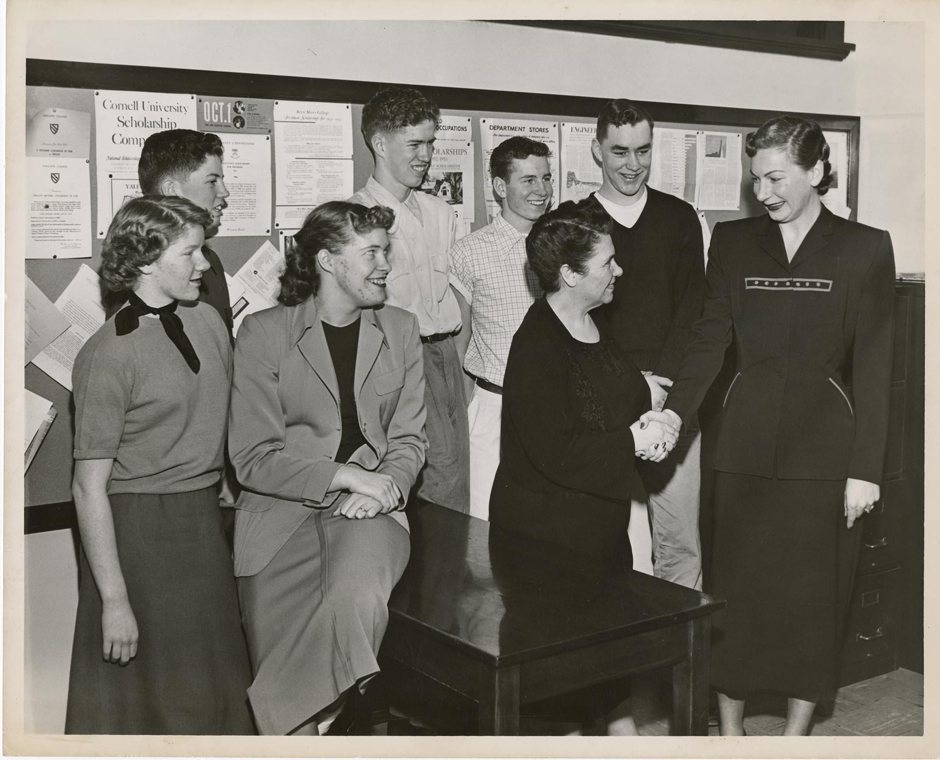 Image of Helene Madison McGiver with teacher and students at Lincoln High School, Seattle, February 1952