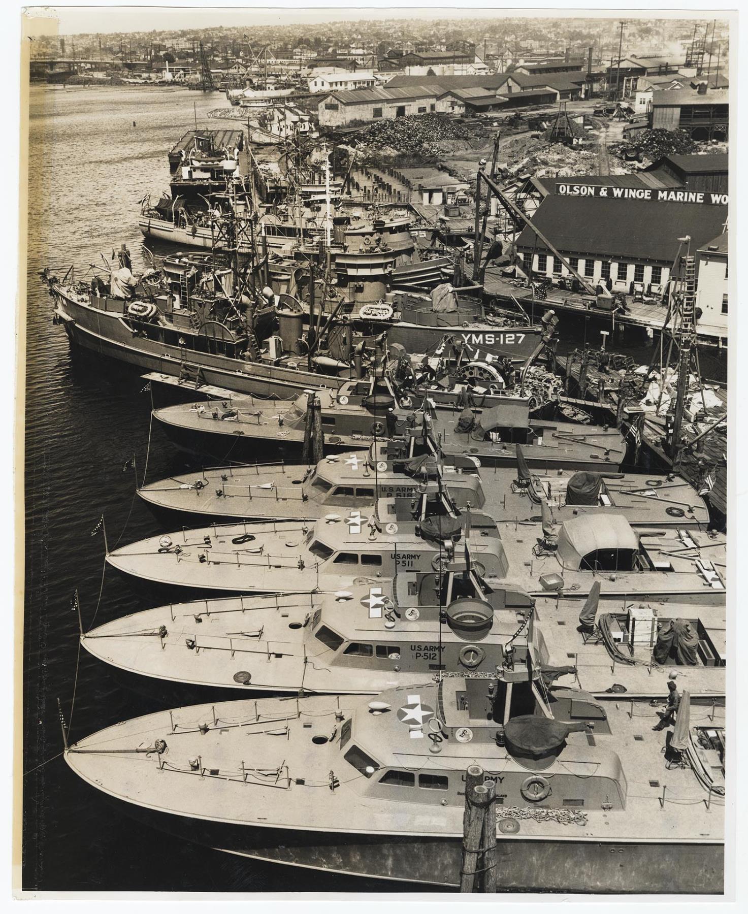 Image of U. S. Army and Navy boats docked at the Olson & Winge Marine Works yard, Seattle, circa 1944