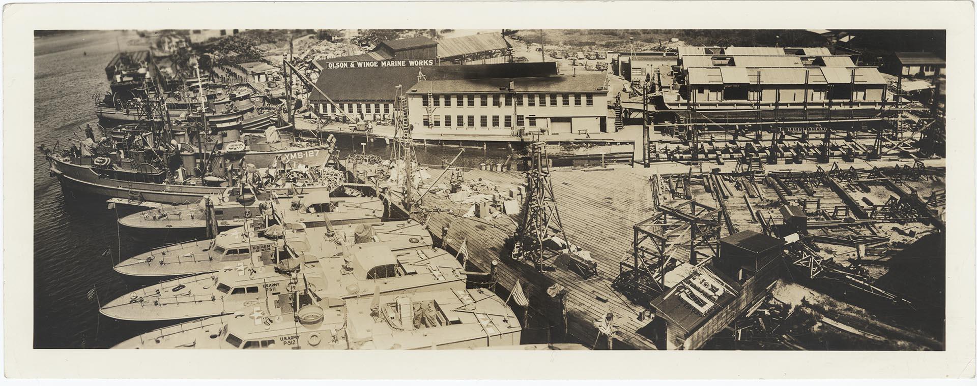 Image of Panoramic view of U. S. Army and Navy boats docked at the Olson & Winge Marine Works yard, Seattle, circa 1944