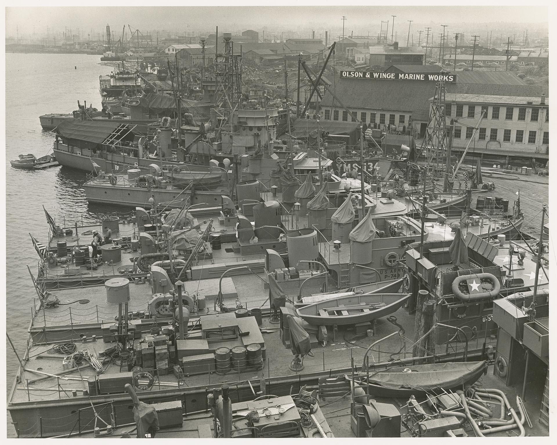 Image of U.S. Army and Navy boats docked at the Olson & Winge Marine Works yard, Seattle, August 1944