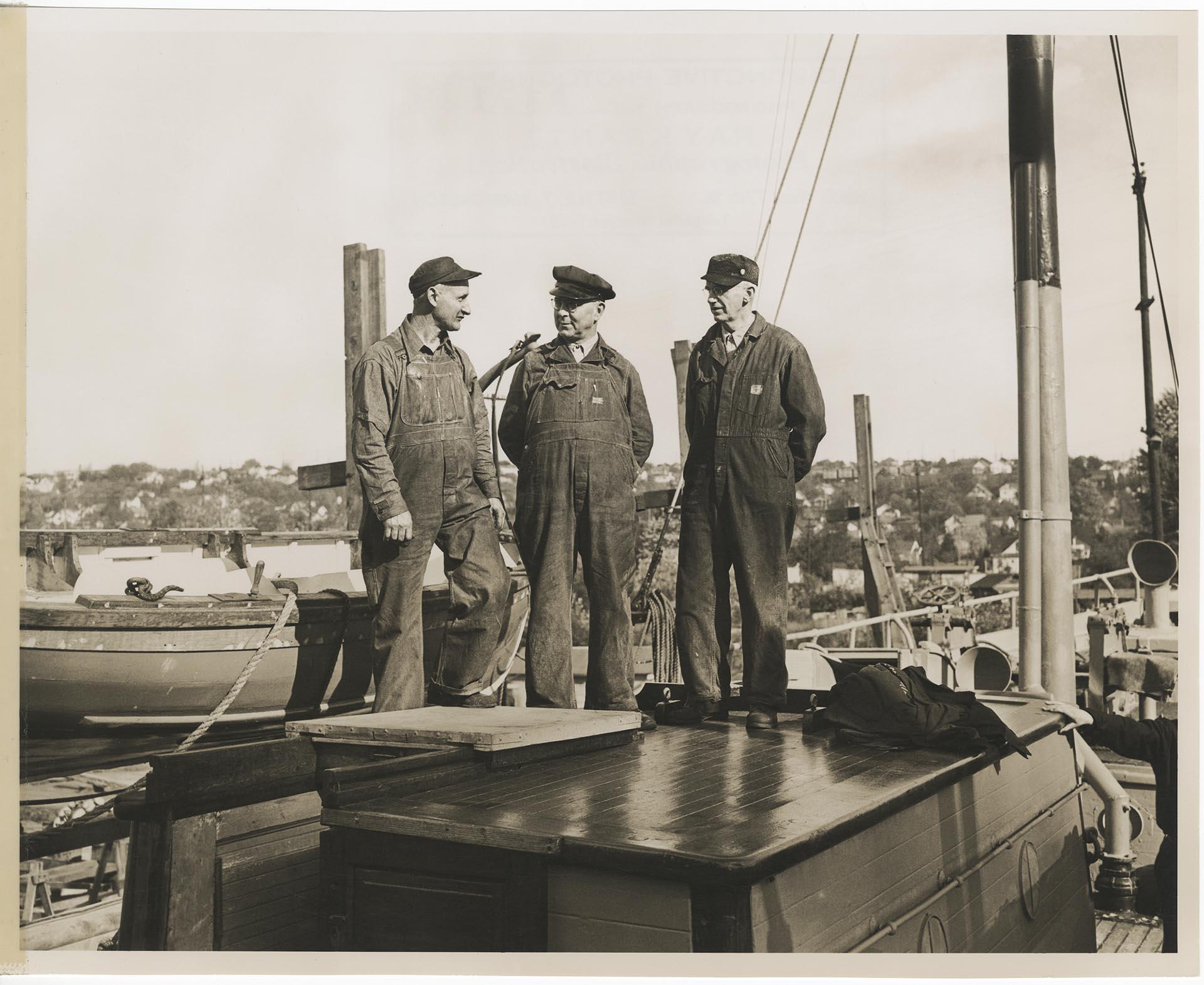 Image of Olson & Winge Marine Works machinists on deck of the Columbia, formerly the King & Winge, Seattle, 1944