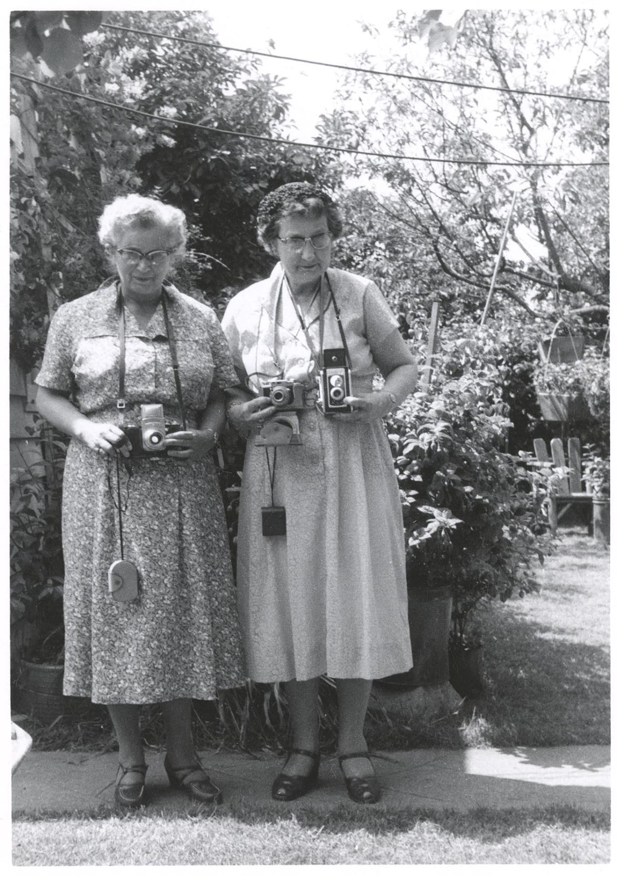 Image of Sue Jean Price and friend with their cameras, Seattle, circa 1964