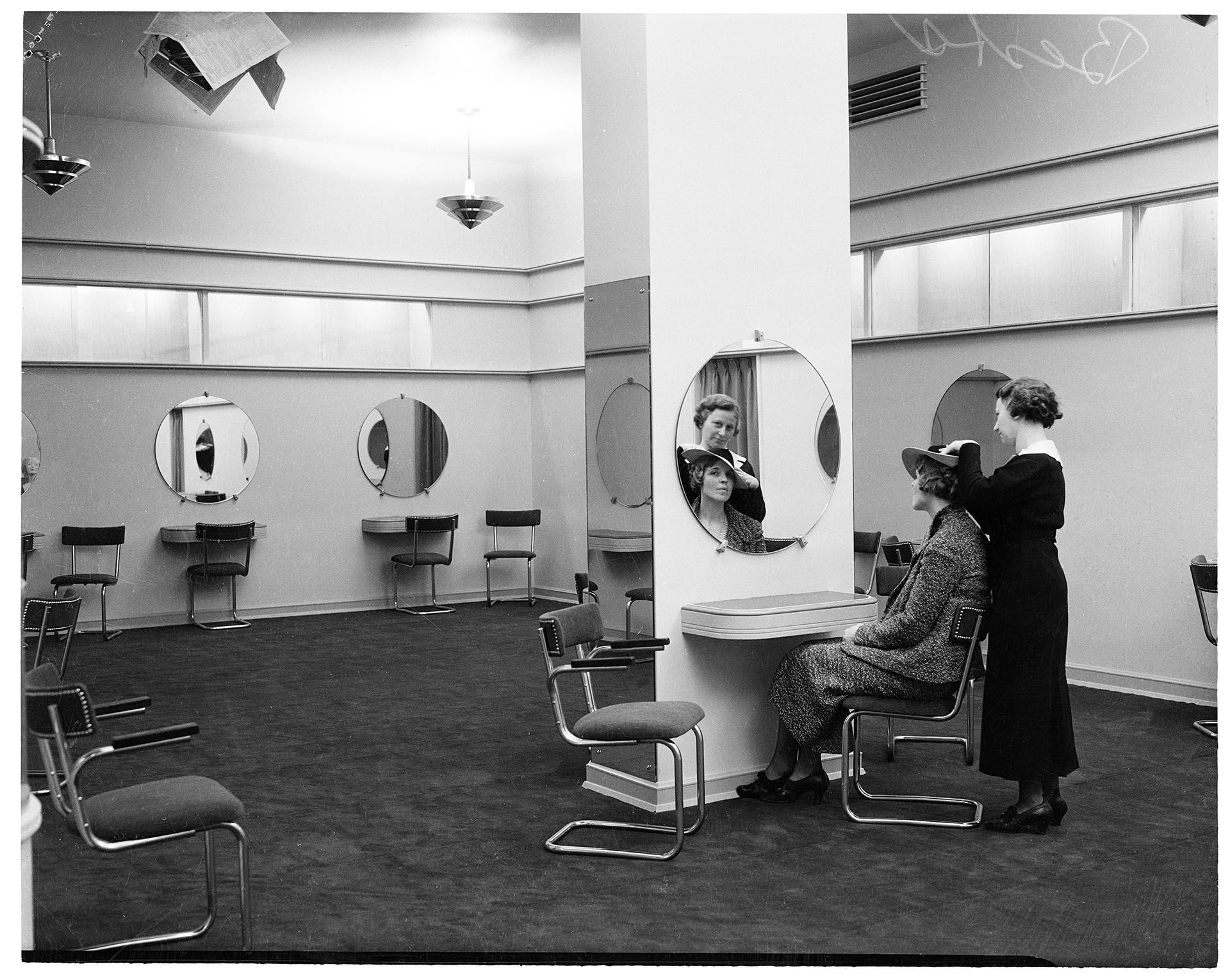 Image of Saleswoman assisting customer at Best's Apparel millinery salon, Seattle, circa 1930