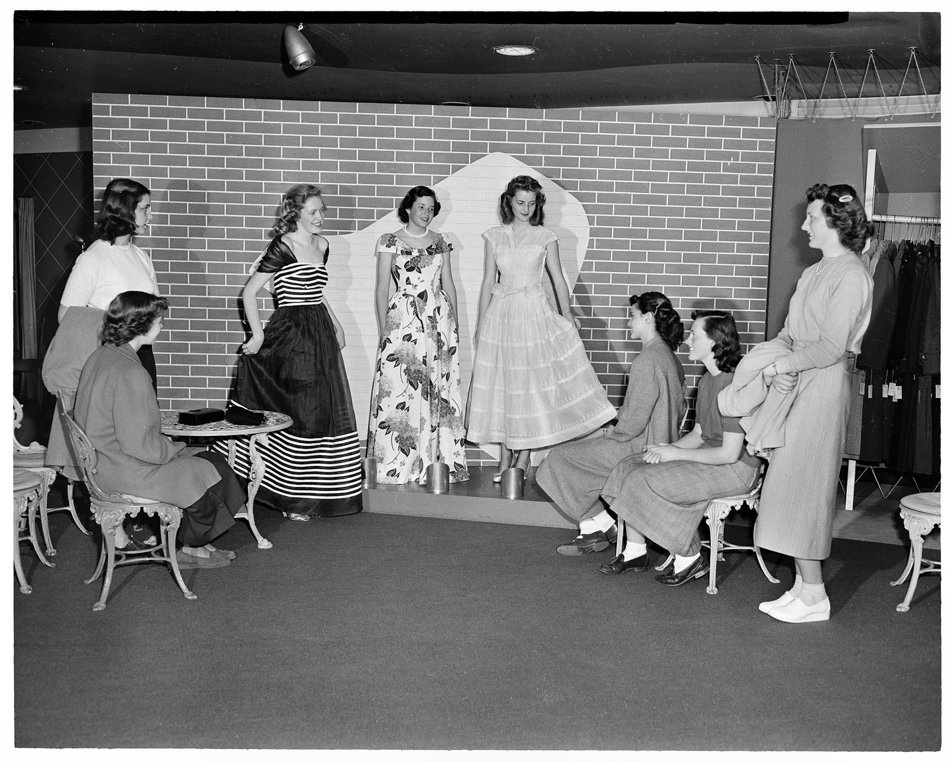Image of Saleswomen displaying garments at Best's Apparel, Seattle, circa 1940