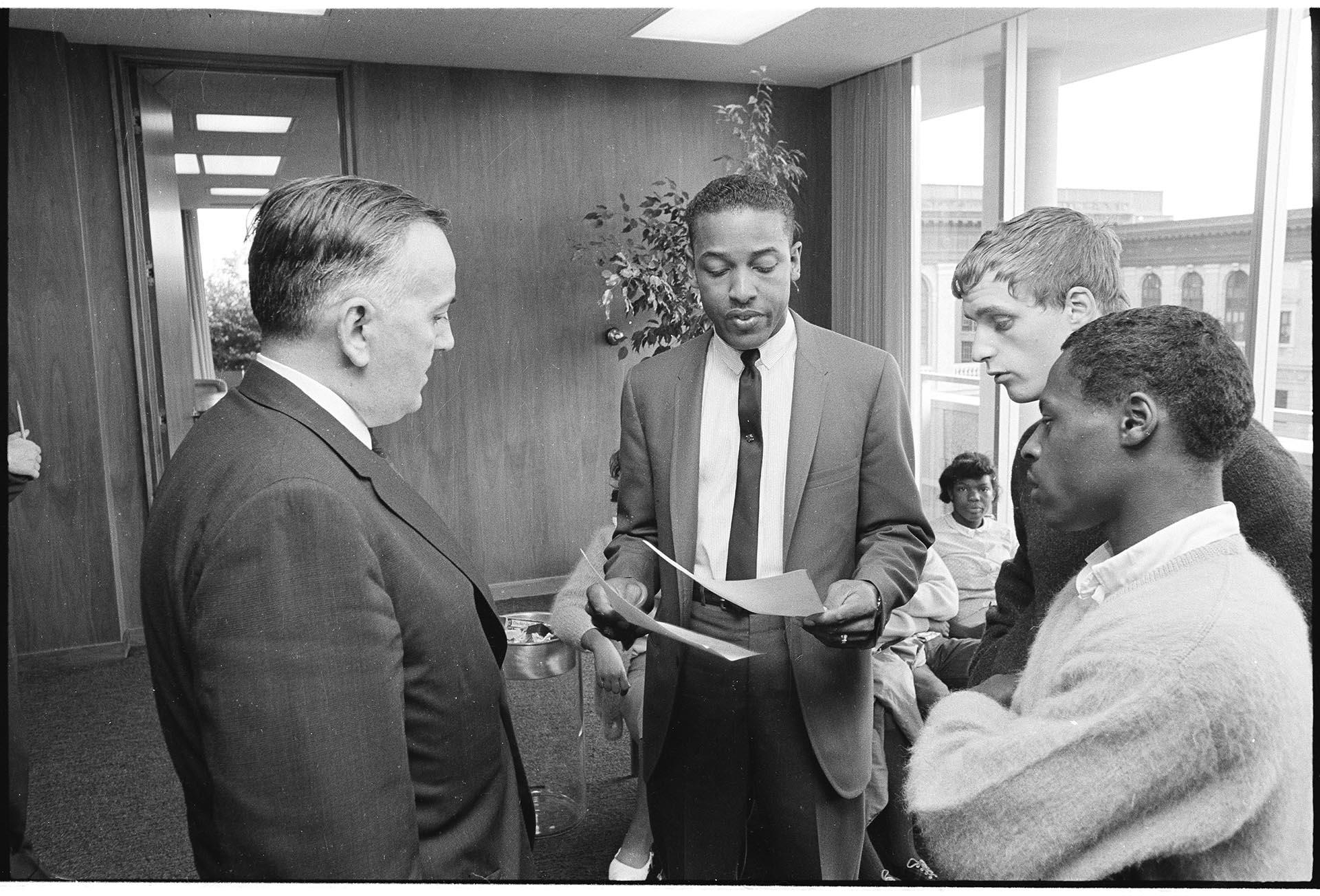 Image of Central Area youth with Ed Devine at Mayor's office, August 20, 1965