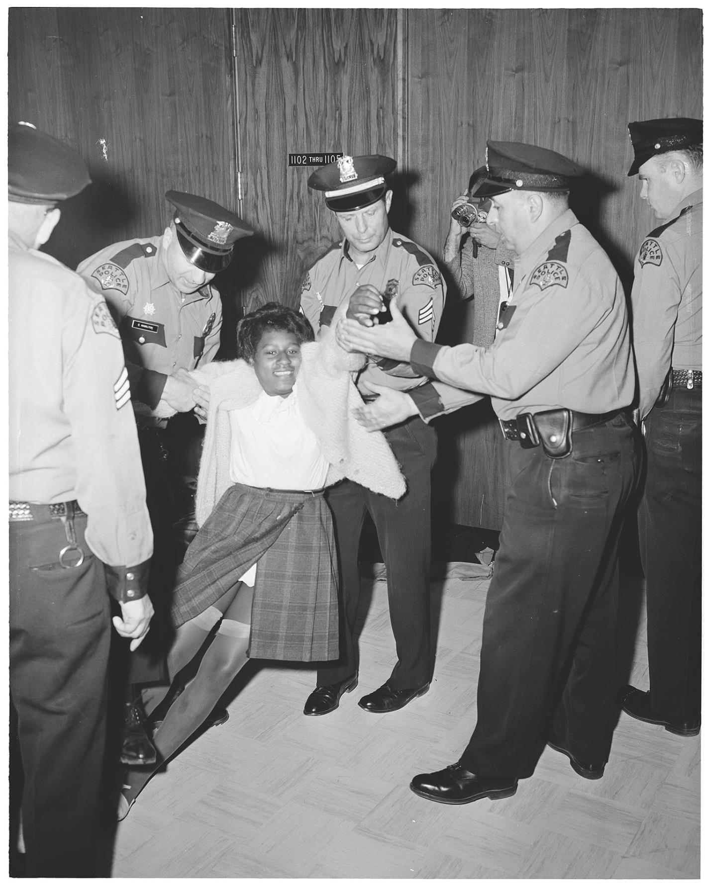 Image of Police removing demonstrator from City Hall, July 25, 1963
