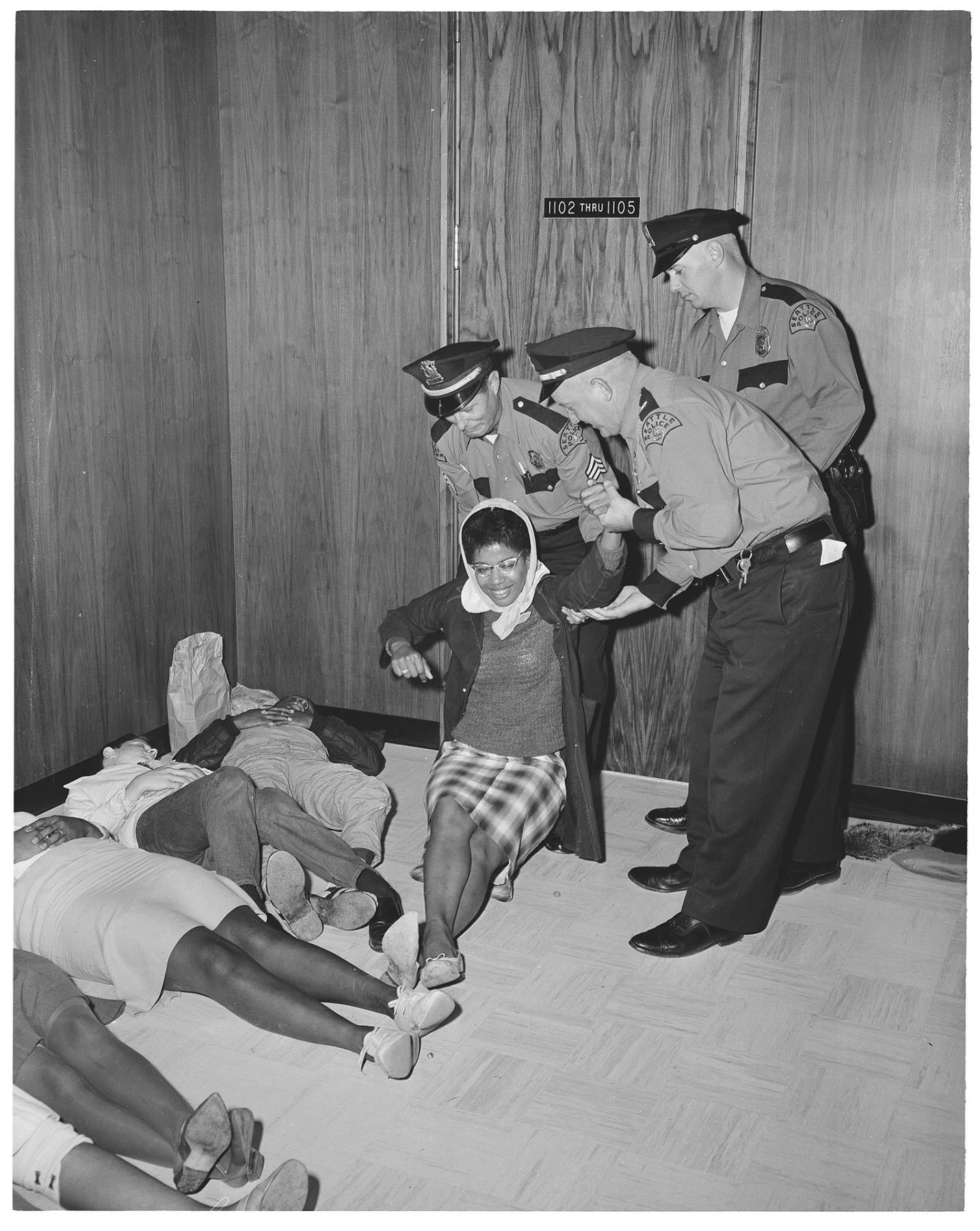 Image of Police removing demonstrator from City Hall, July 25, 1963