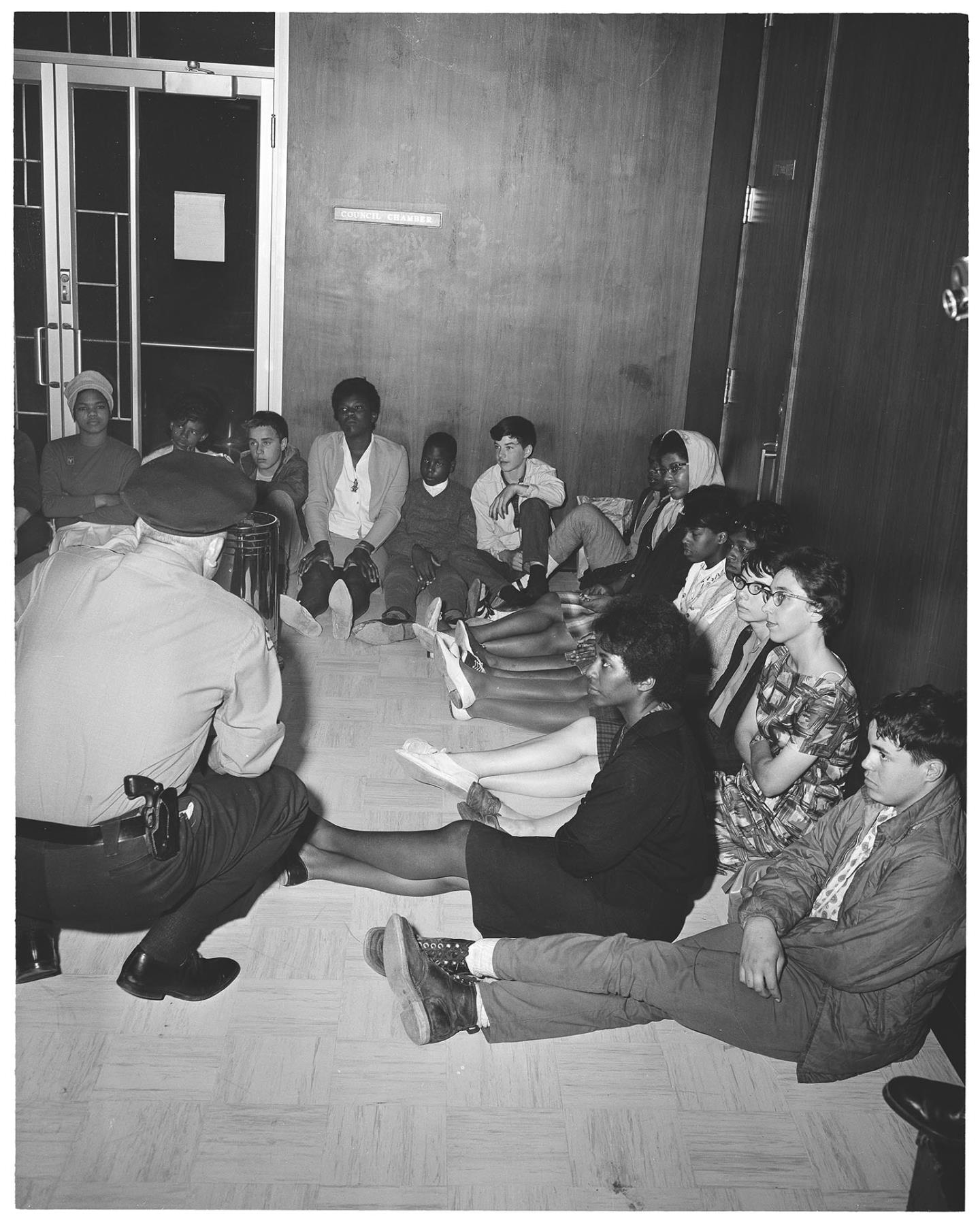 Image of Assistant Police Chief Charles Rouse with demonstrators at City Hall, July 25, 1963