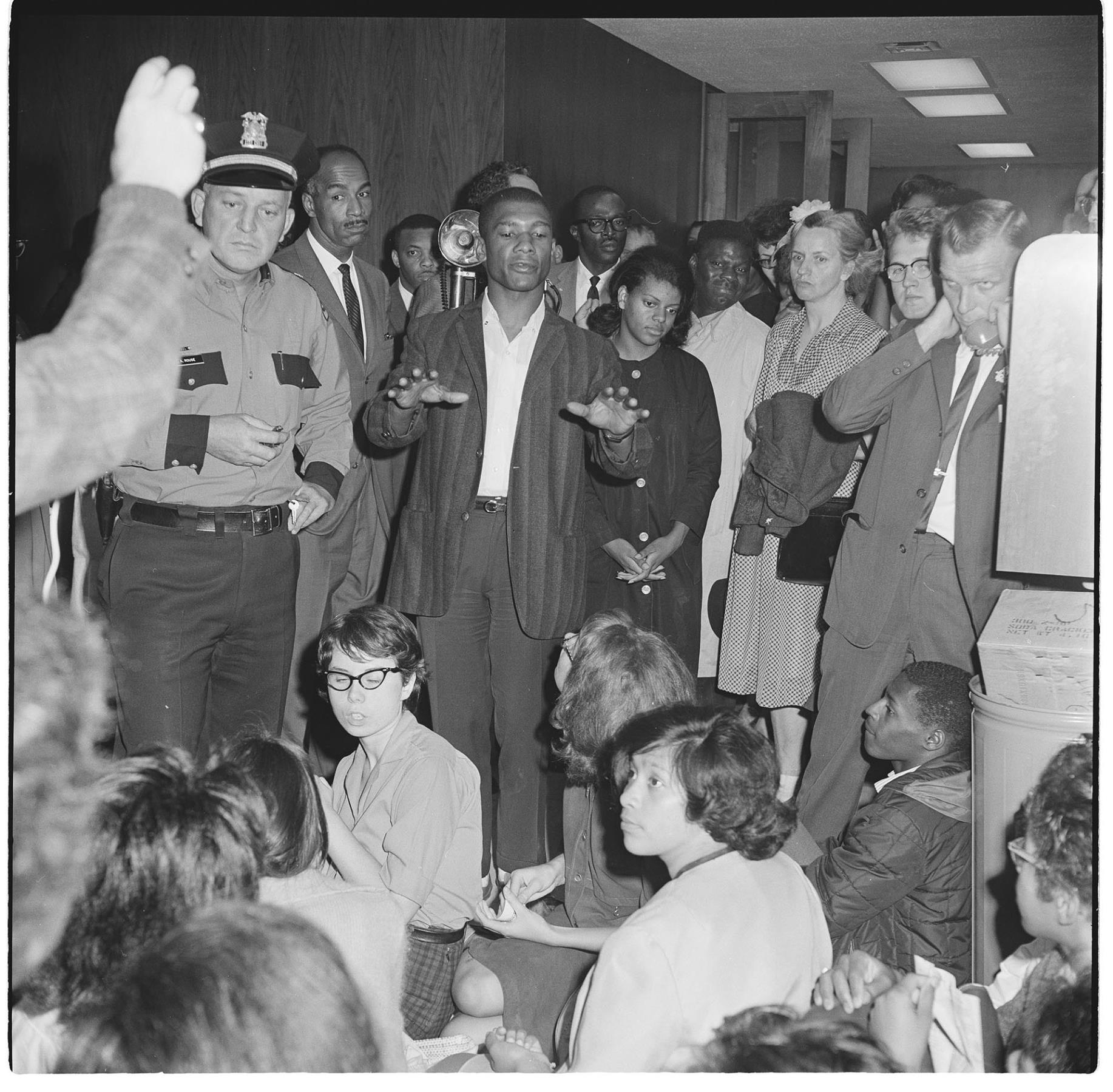 Image of Eddie Givens addressing demonstrators at City Hall sit-in, July 25, 1963