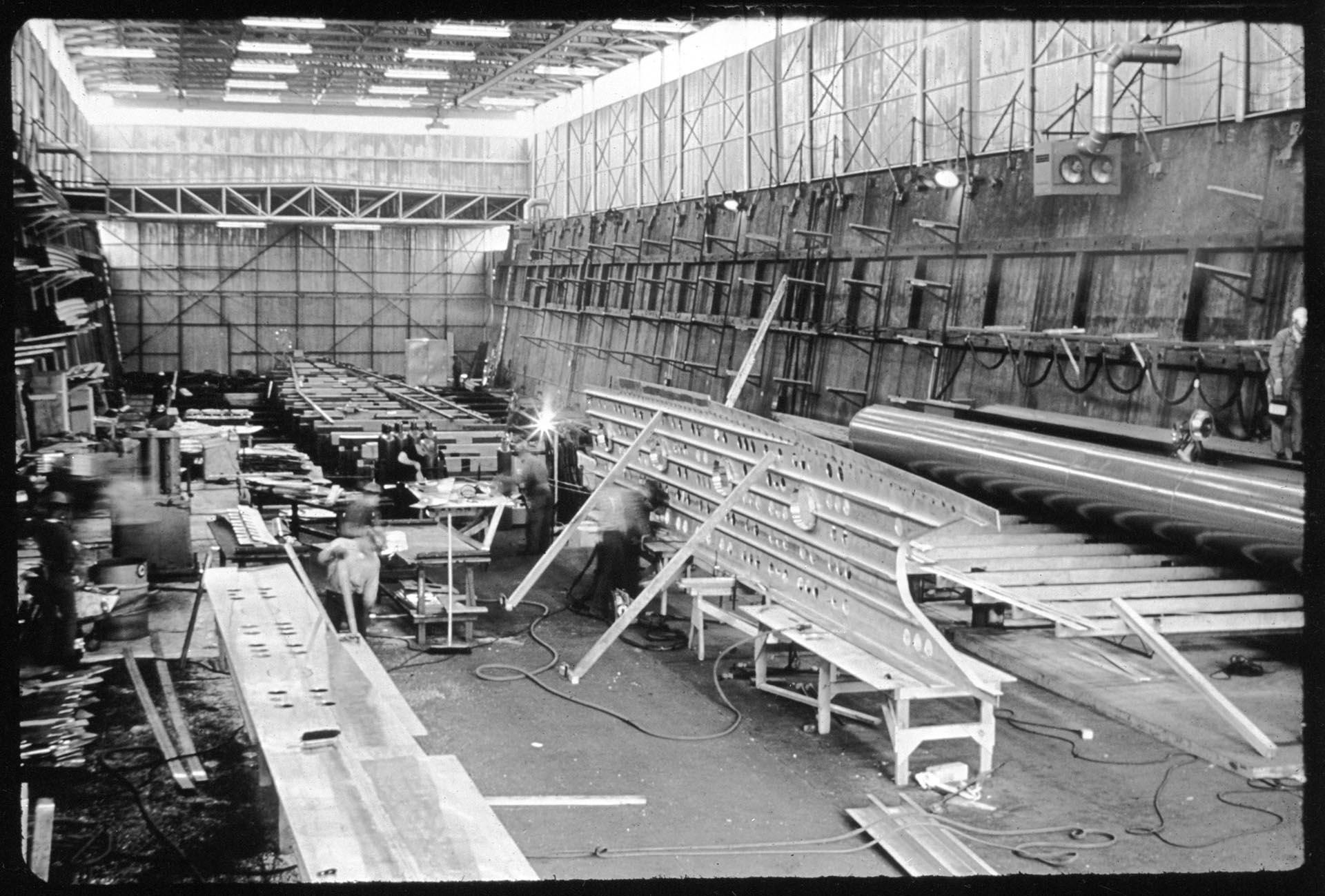 Image of Lockheed Shipbuilding and Construction Company employees working on the USS Plainview, Seattle, 1964