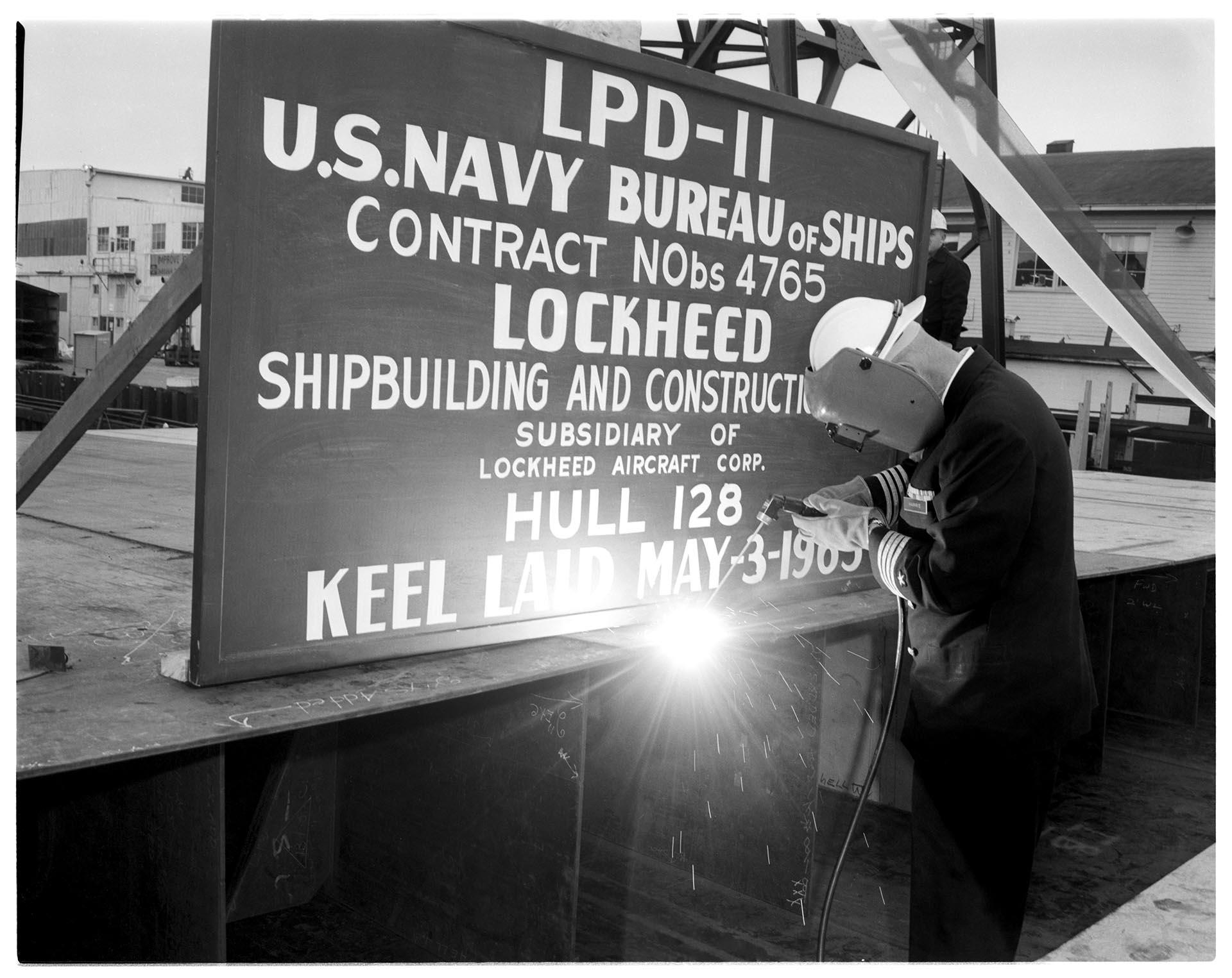 Image of Welder at launch of the USS Coronado at the Lockheed Shipbuilding and Construction Company shipyard, Seattle, July 1, 1966