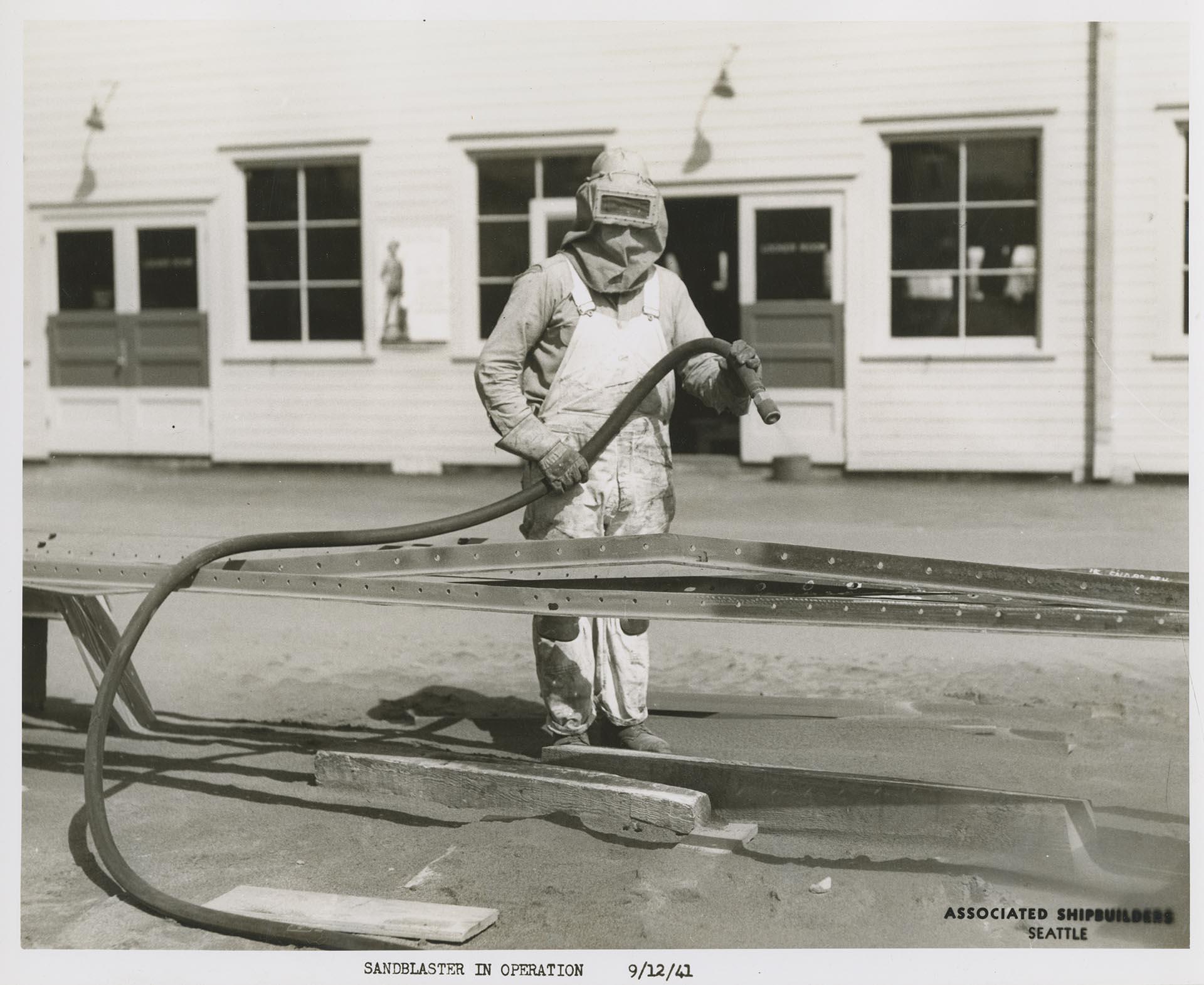 Image of Associated Shipbuilders employee operating a sandblaster, Seattle, September 12, 1941