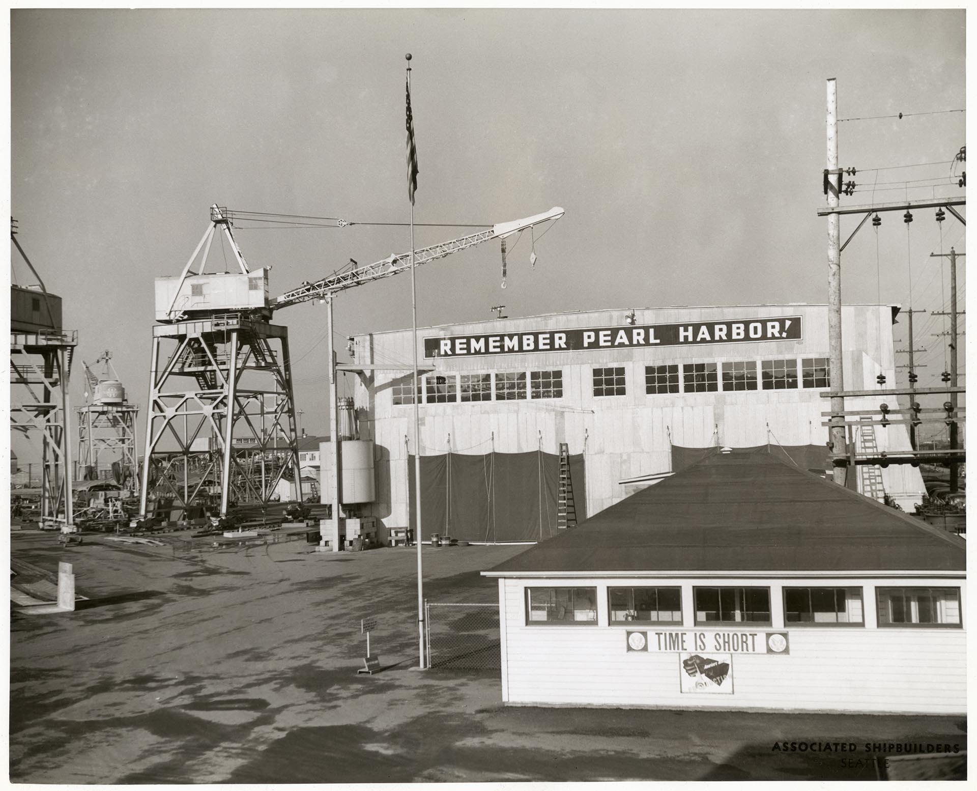 Image of Remember Pearl Harbor sign at Associated Shipbuilders shipyard, Seattle, December 30, 1941