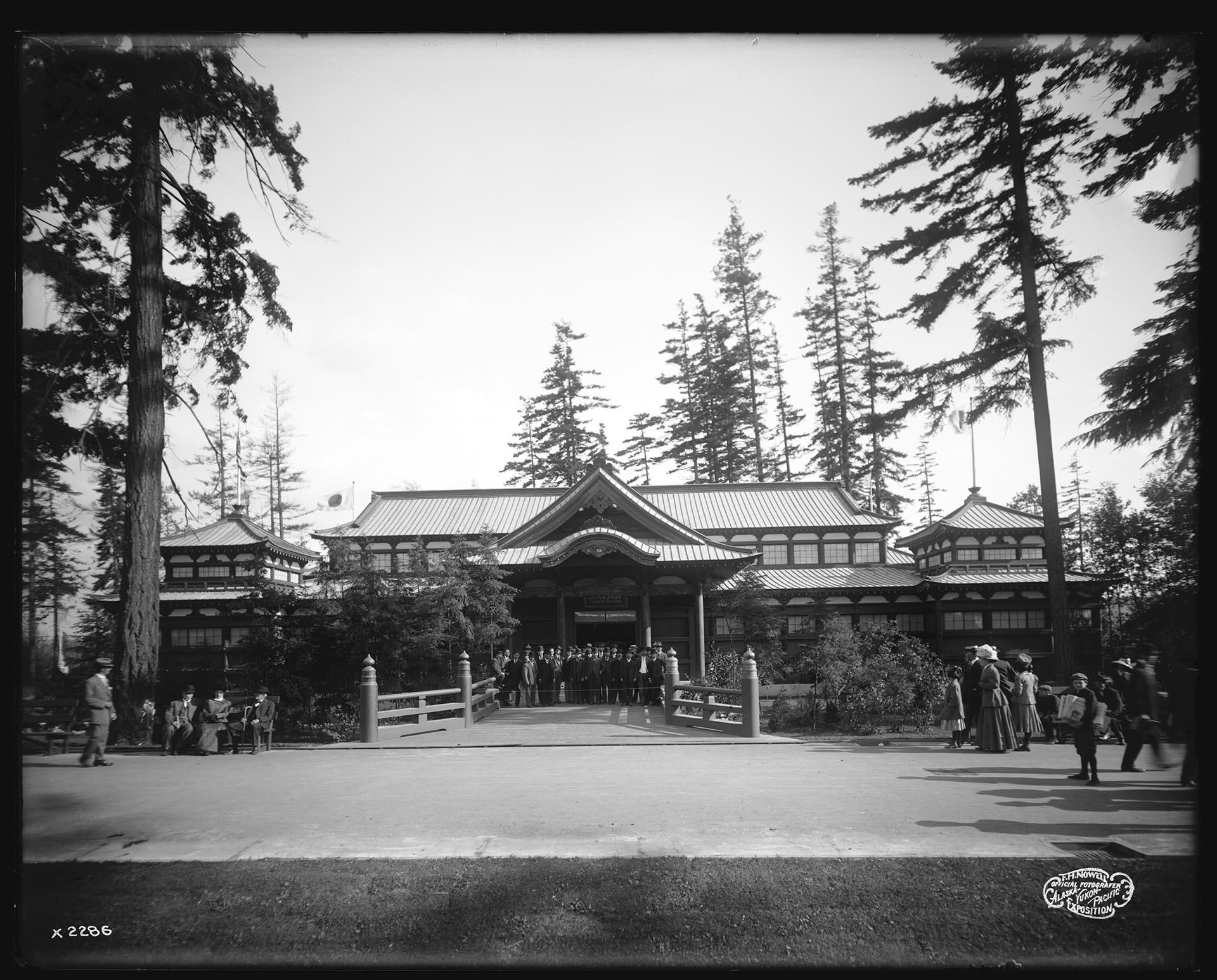 Image of Men posing in front of Japan Exhibit Building at the Alaska-Yukon-Pacific Exposition, 1909