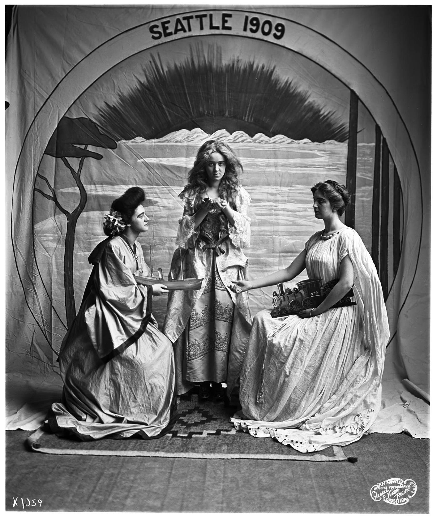Image of Staging of Alaska-Yukon Pacific Exposition emblem with live models, Seattle, 1909