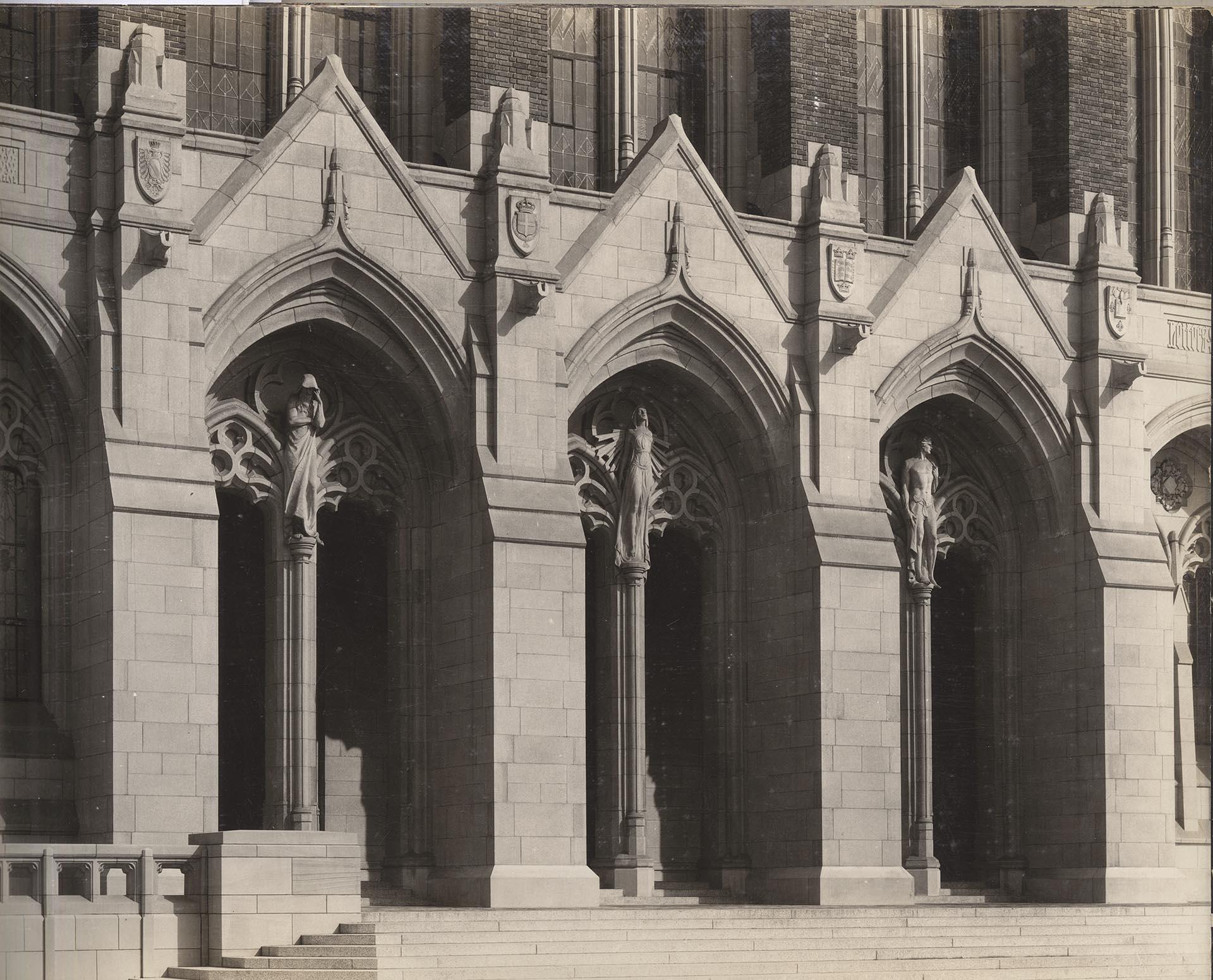 Image of Three cast stone statues above entrance to Suzzallo Library, Seattle, circa 1927