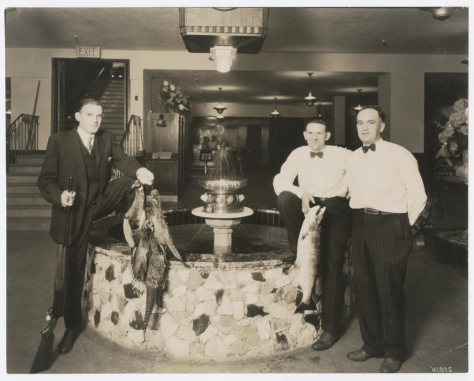 Image of Ben Paris and two men posing at Ben Paris Sporting Goods and Recreation, Seattle, circa 1935