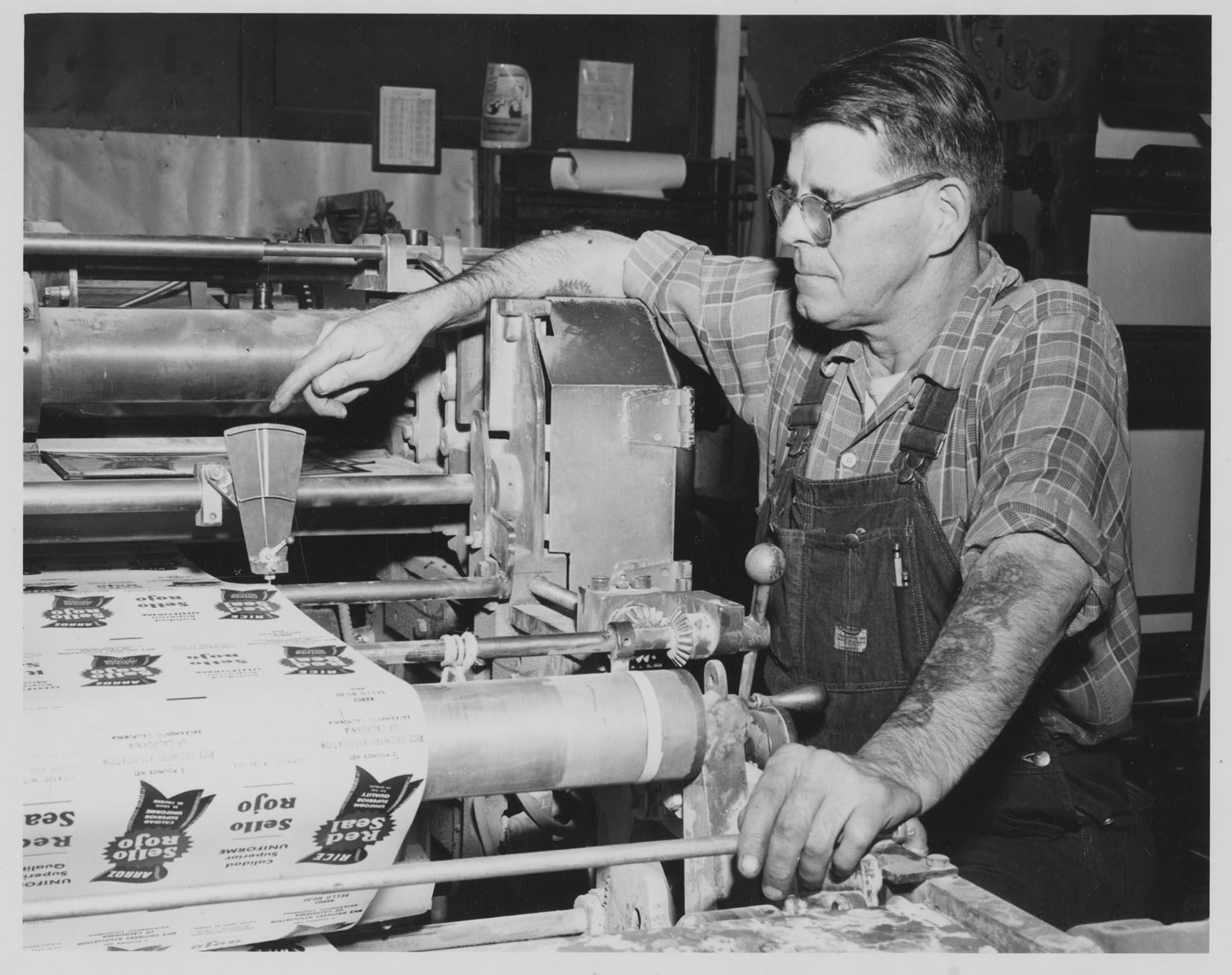 Image of Man at Bemis Bag Co. monitoring paper bag production, circa 1950