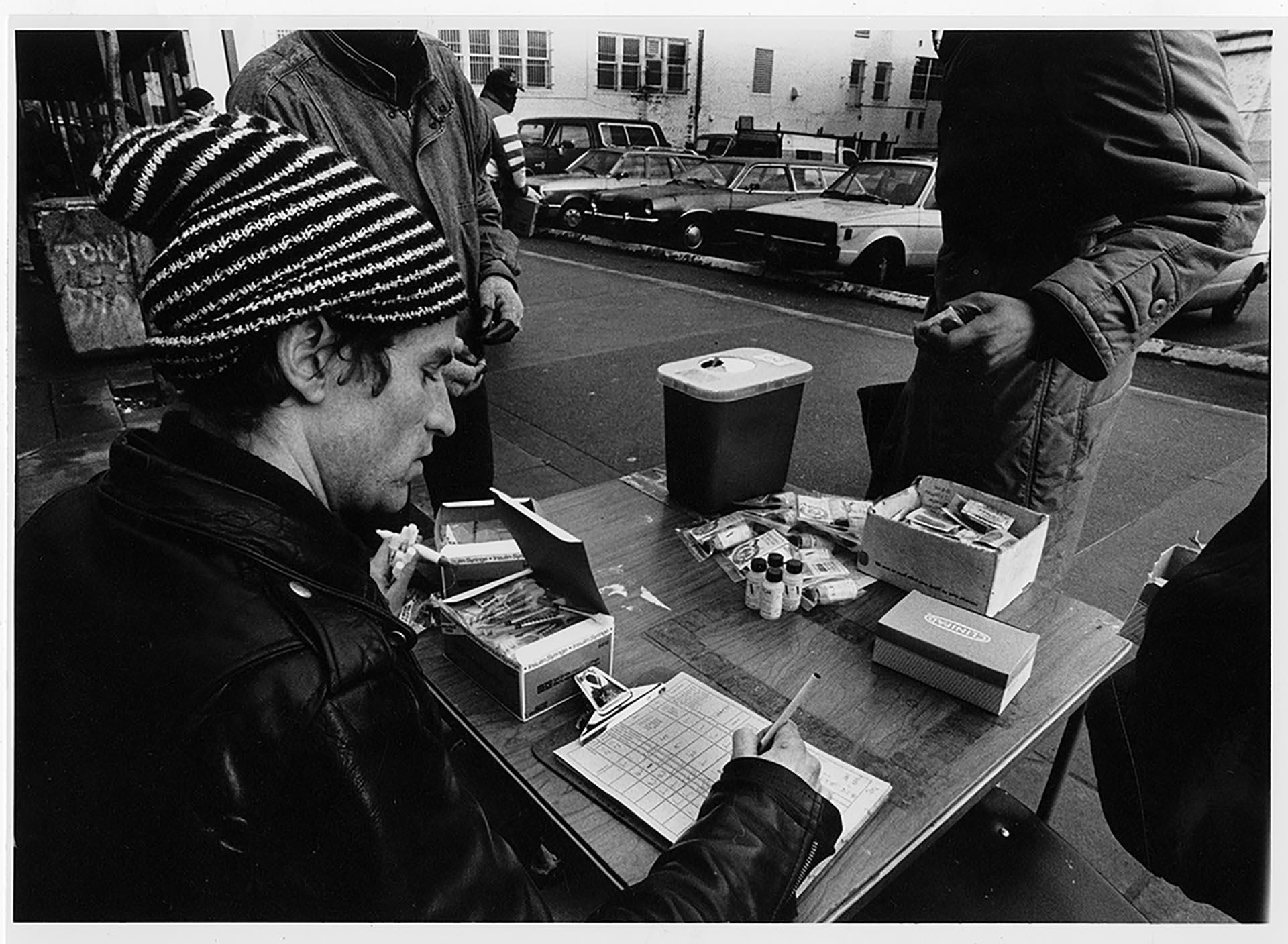 Image of AIDS Prevention Project volunteer at needle exchange, Seattle, February 20, 1990
