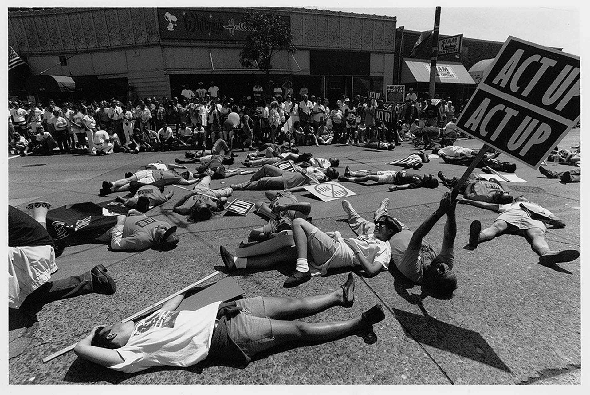 Image of Demonstrators lying on ground at ACT-UP demonstration, Seattle, June 26, 1990