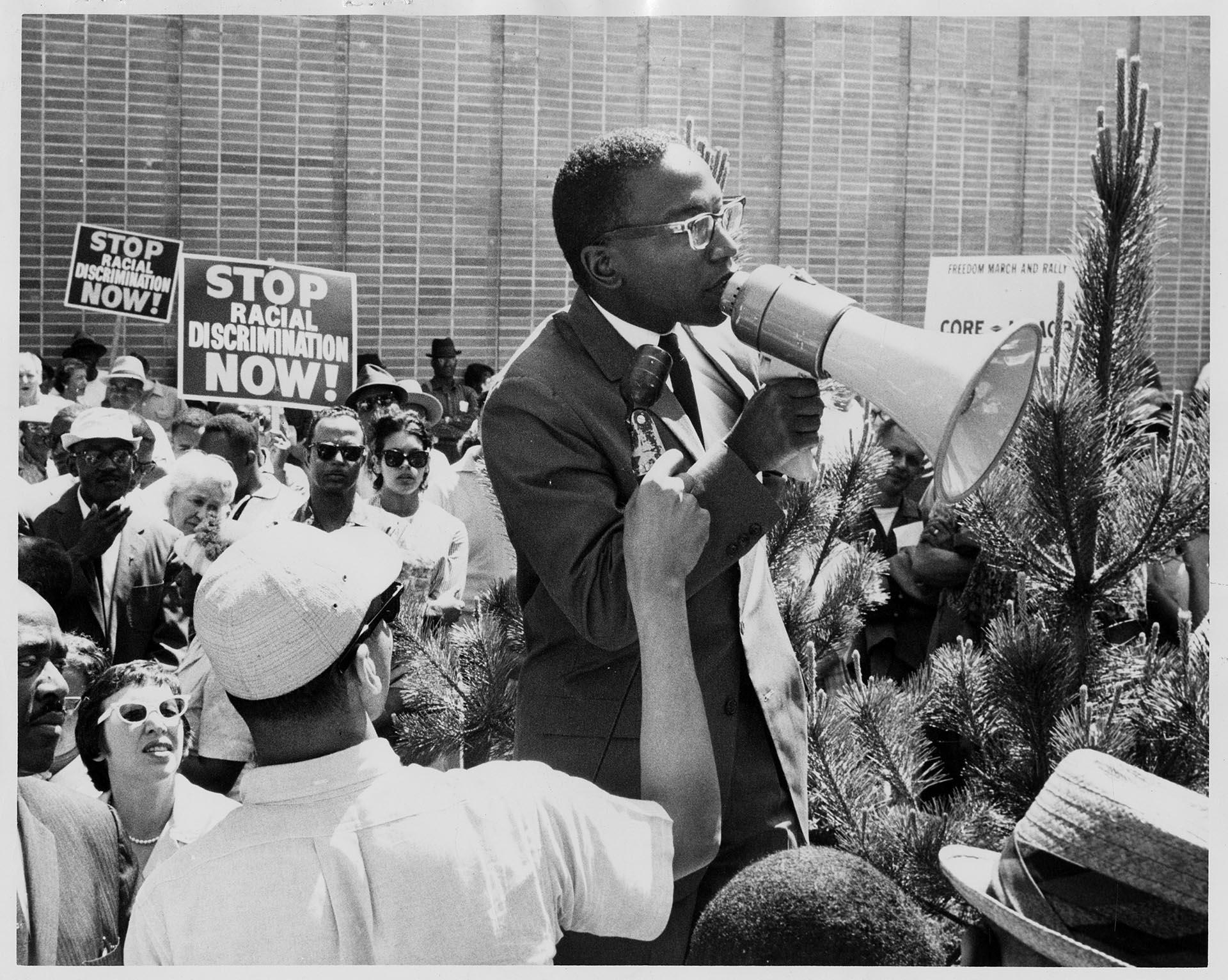 Image of Reginald Alleyne speaking to crowd at Westlake Mall, Seattle, June 15, 1963