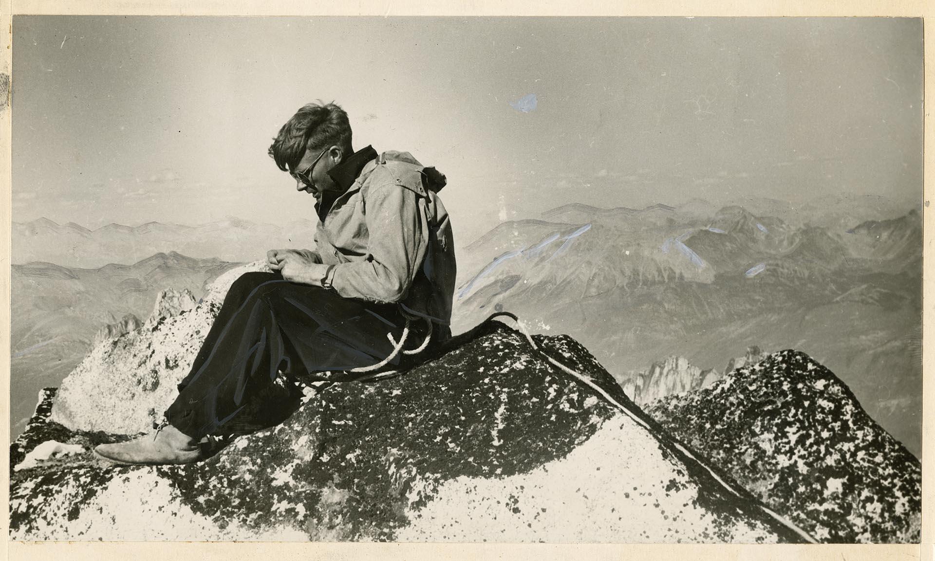 Image of Lloyd Anderson resting on Howser Spire, British Columbia, 1941
