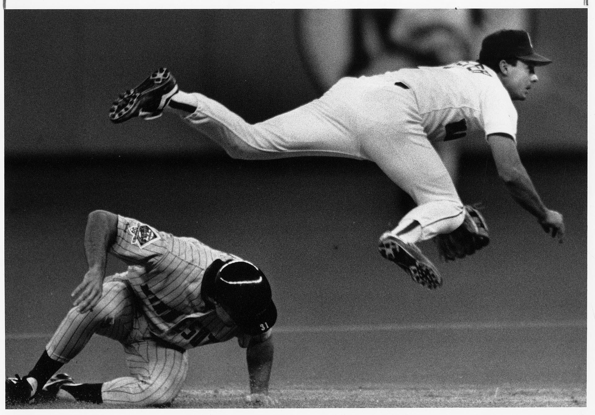 Image of Seattle Mariners shortstop Jeff Schaefer jumping over base runner, April 15, 1991