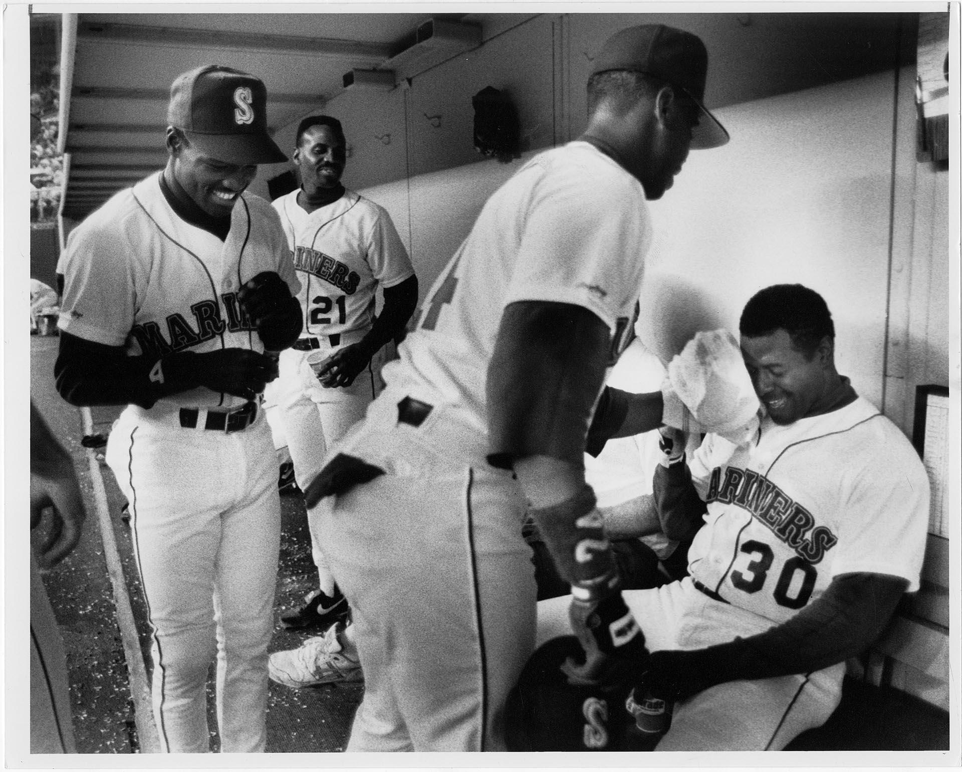 Image of Ken Griffey Sr. and Ken Griffey Jr. in Mariners dugout, April 1991