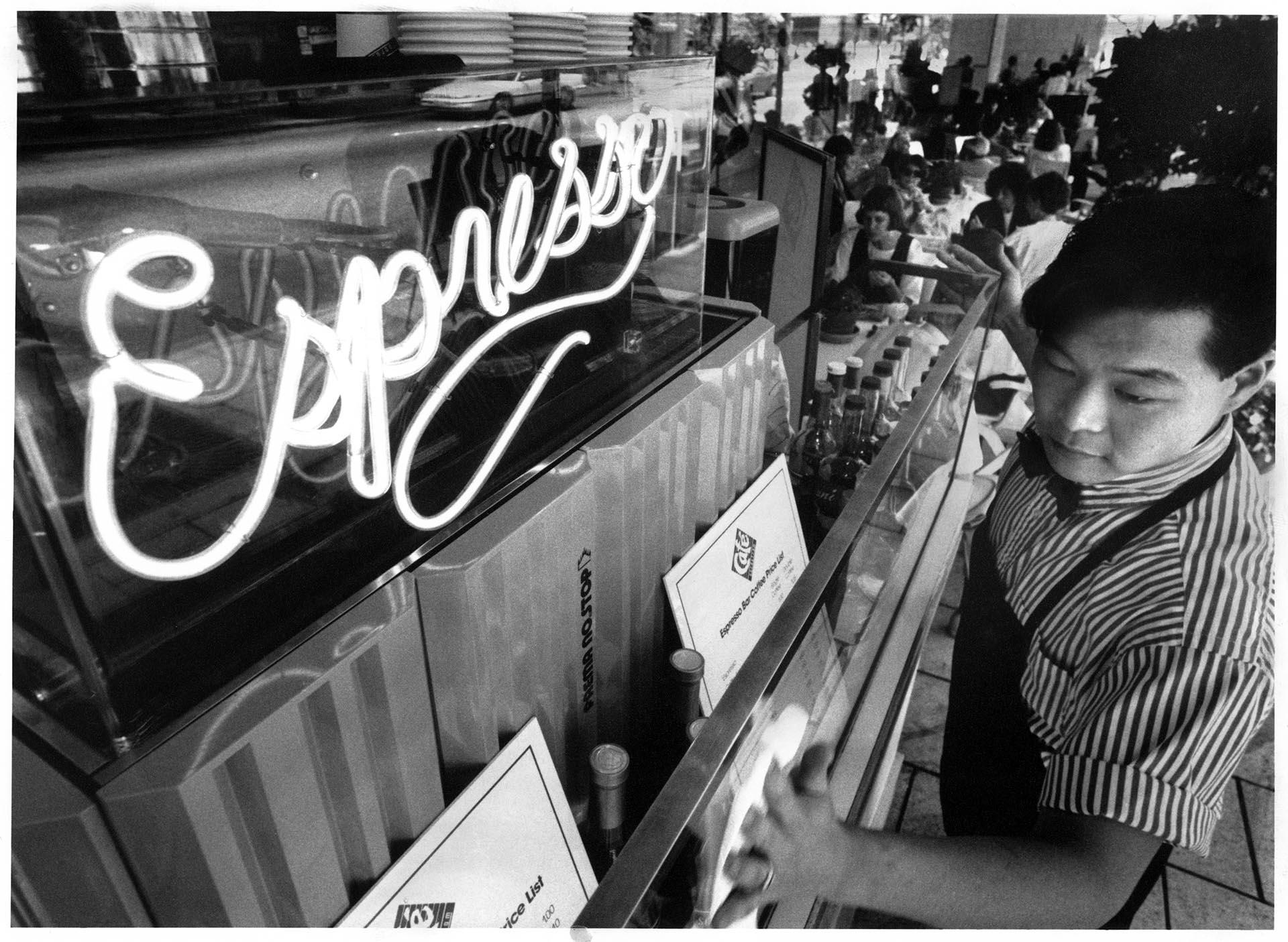 Image of Barista Jeffrey Kirihara working at Nordstrom's espresso bar, July 12, 1990