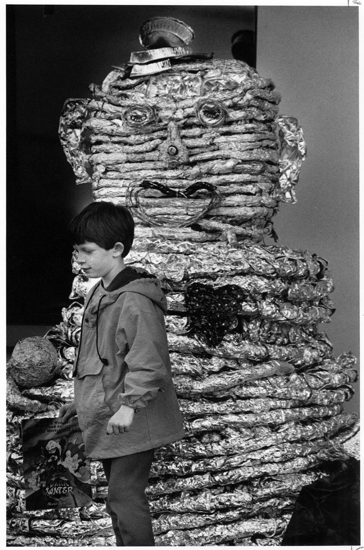 Image of Philip Ripley with aluminum foil statue at Renton Park Elementary School, Renton, April 14, 1992