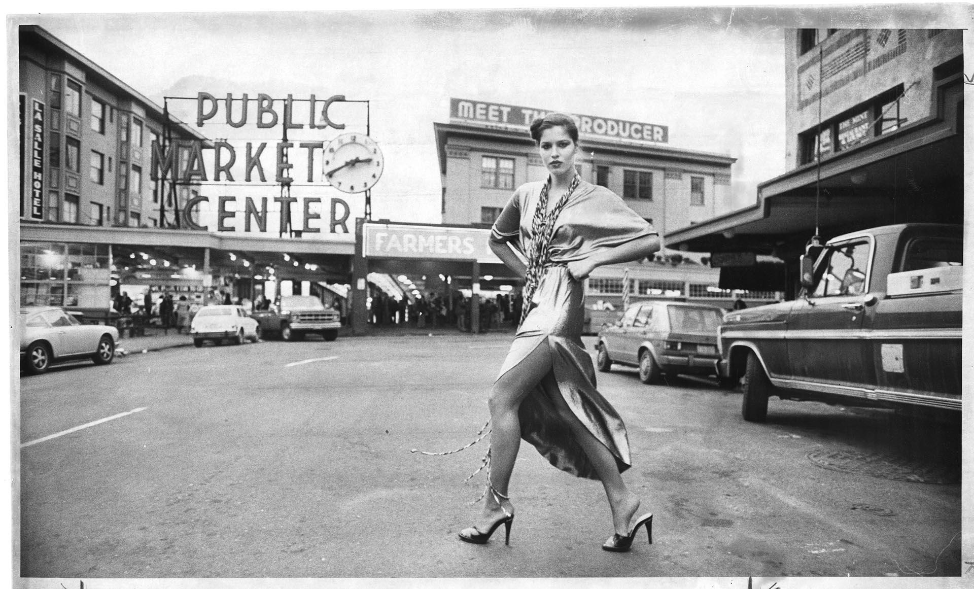 Image of Model posing in Egyptian-inspired dress at Pike Place Market, Seattle, November 30, 1978