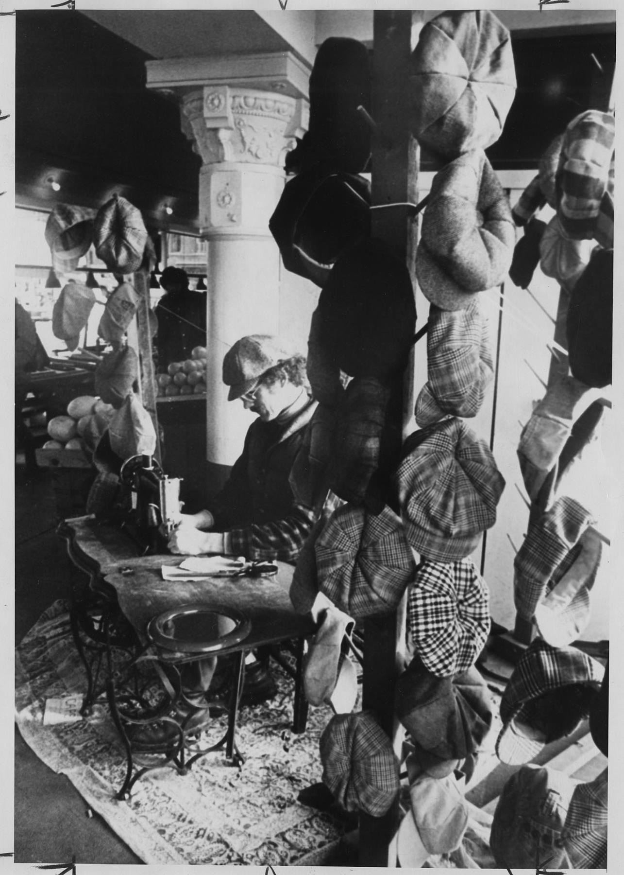 Image of Man making hats in stall at Pike Place Market, Seattle, November 27, 1977