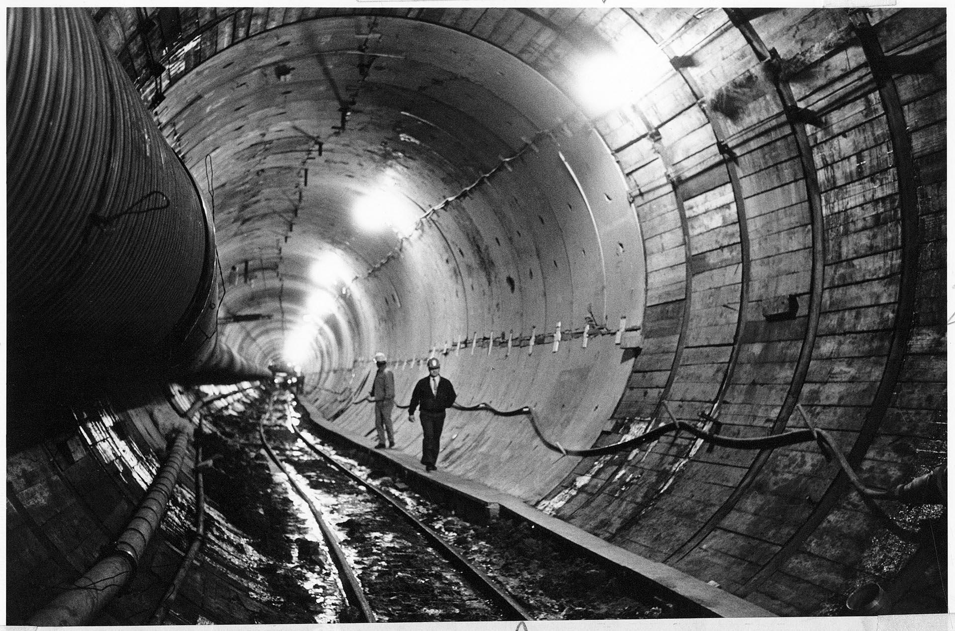 Image of Two men walking in bus tunnel, Seattle, January 19, 1988