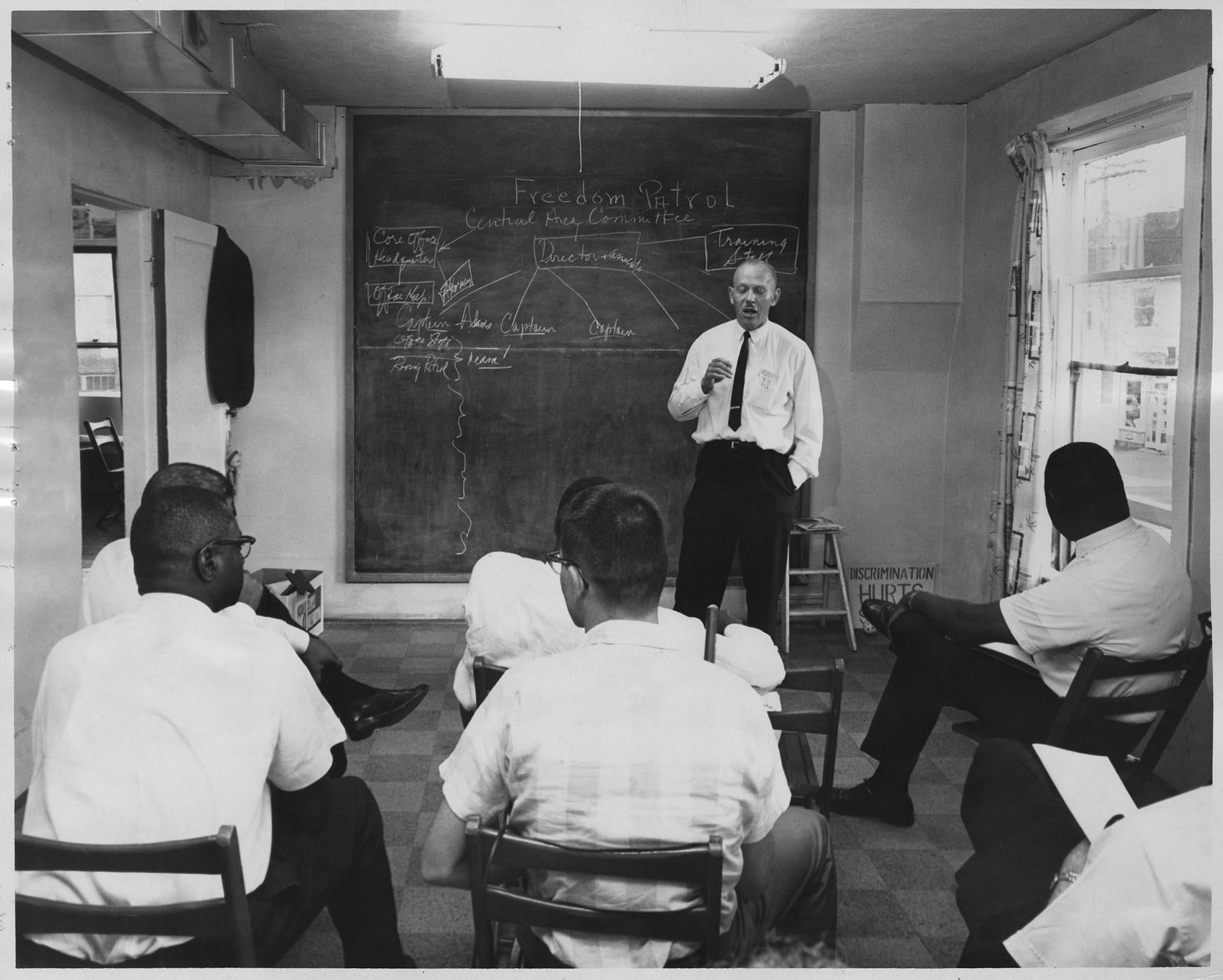 Image of Rev. Dr. John H. Adams with Freedom Patrol members at CORE headquarters, Seattle, July 24, 1965