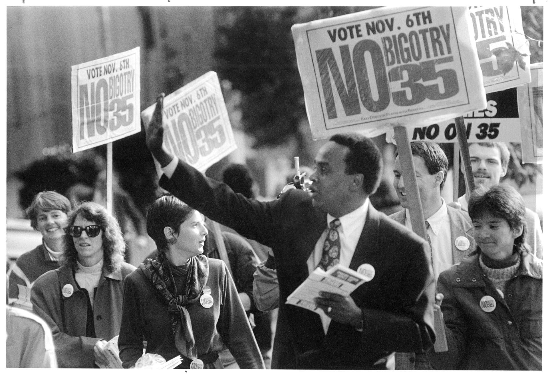 Image of Norm Rice and others campaigning against Initiative 35 in downtown Seattle, November 6, 1990
