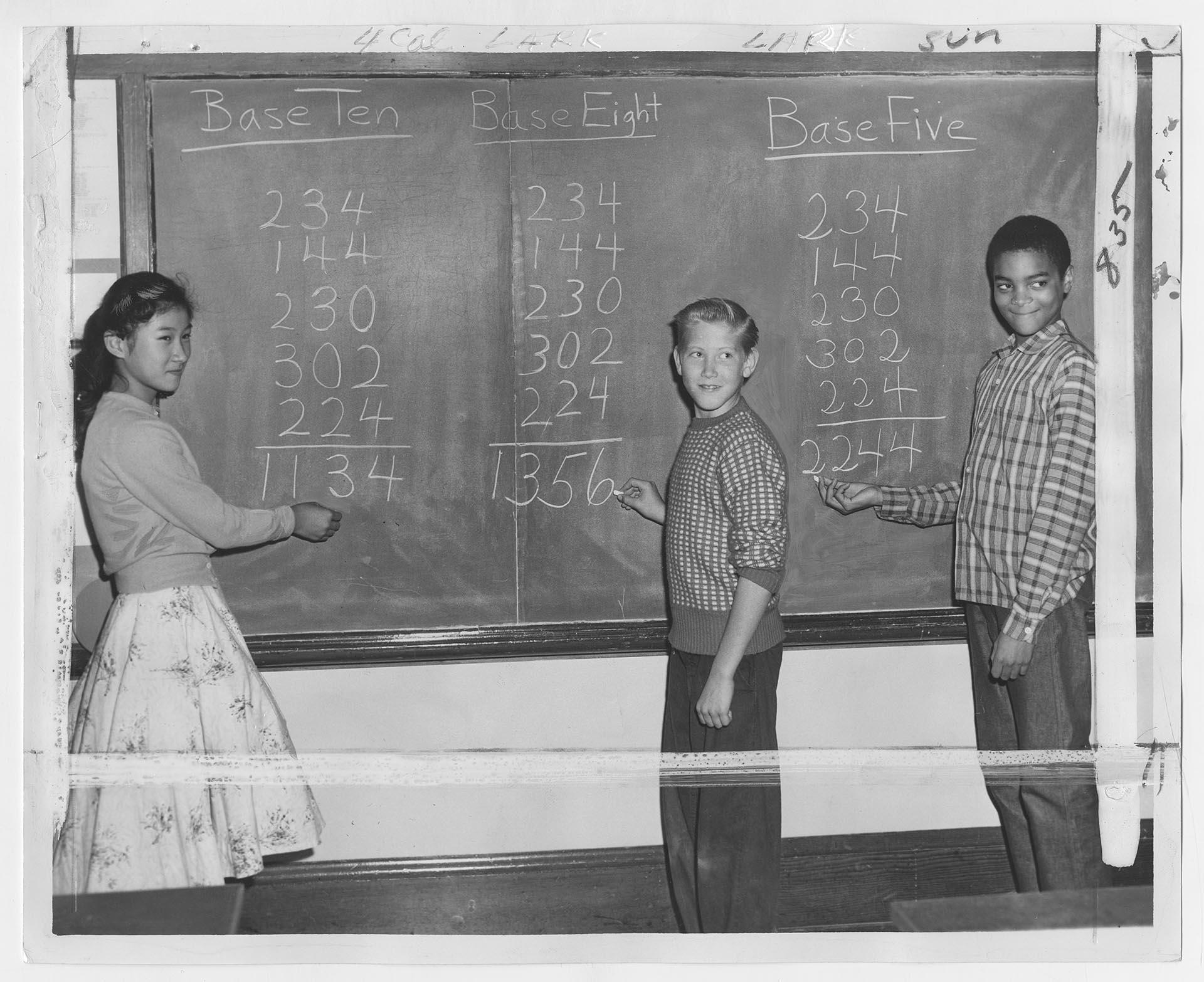 Image of Three students doing math on blackboard at Meany Jr. High, Seattle, October 3, 1958