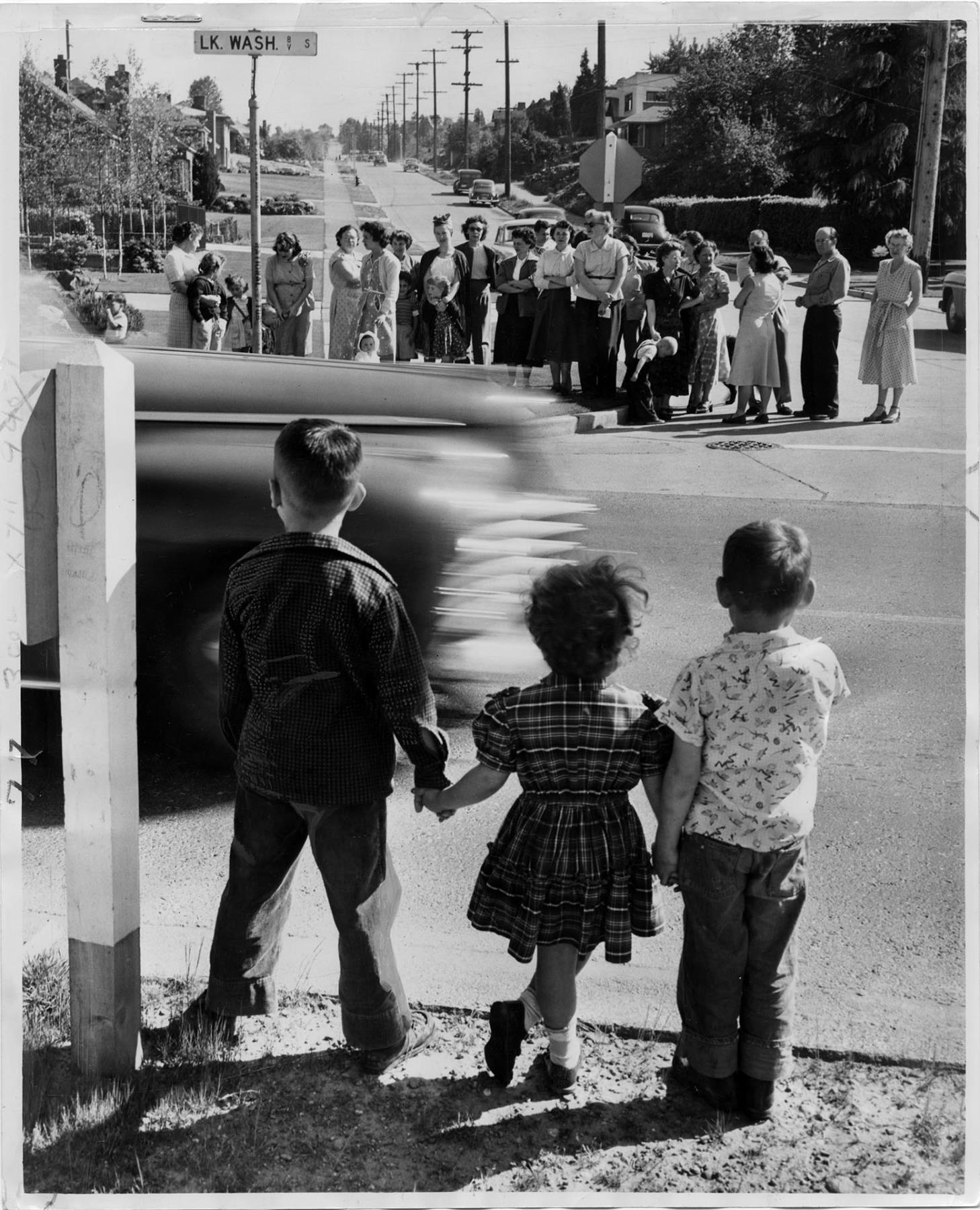 Image of Children waiting to cross Lake Washington Blvd., Seattle, May 11, 1953