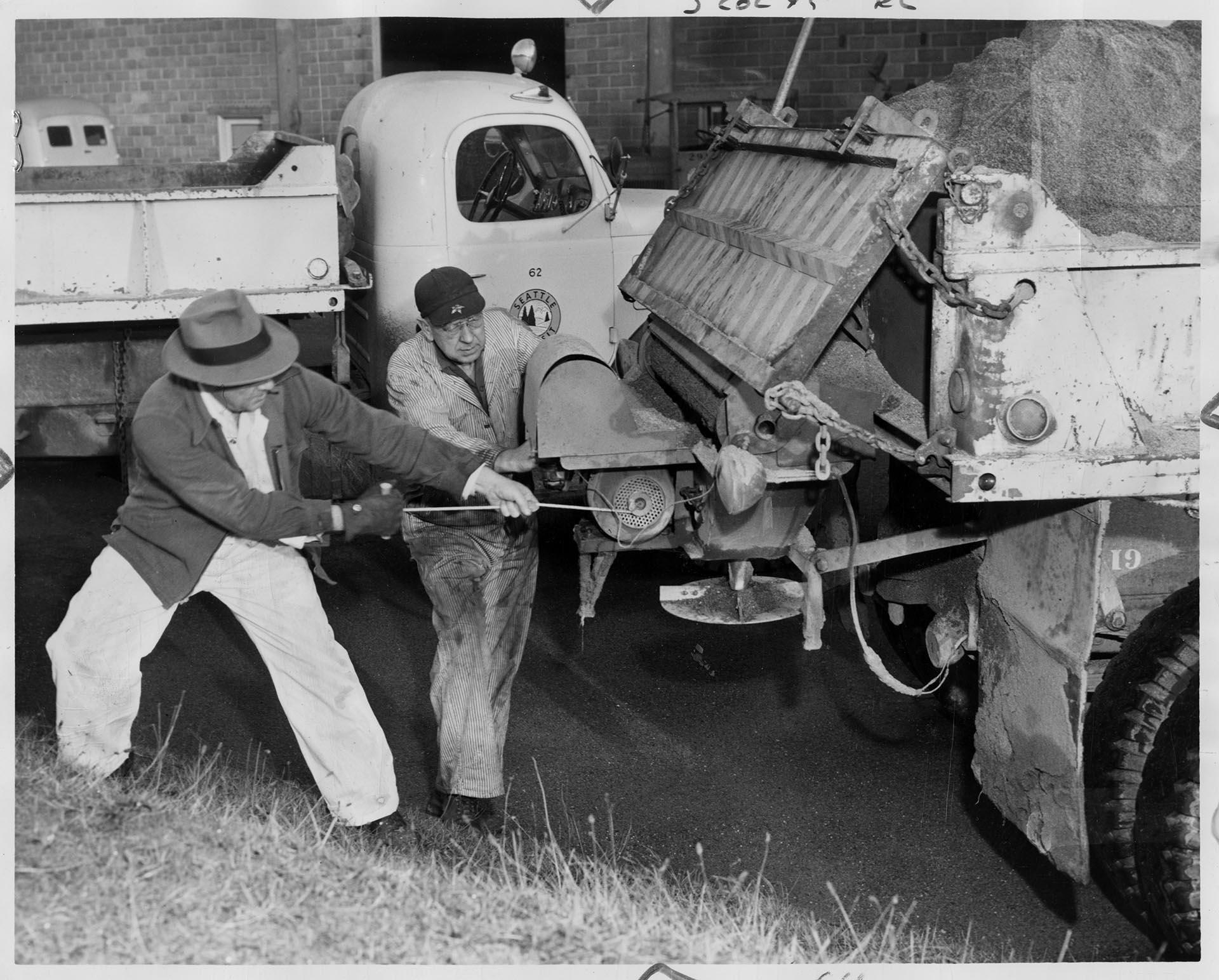 Image of Men preparing a transit system sand truck, Seattle, December 29, 1951