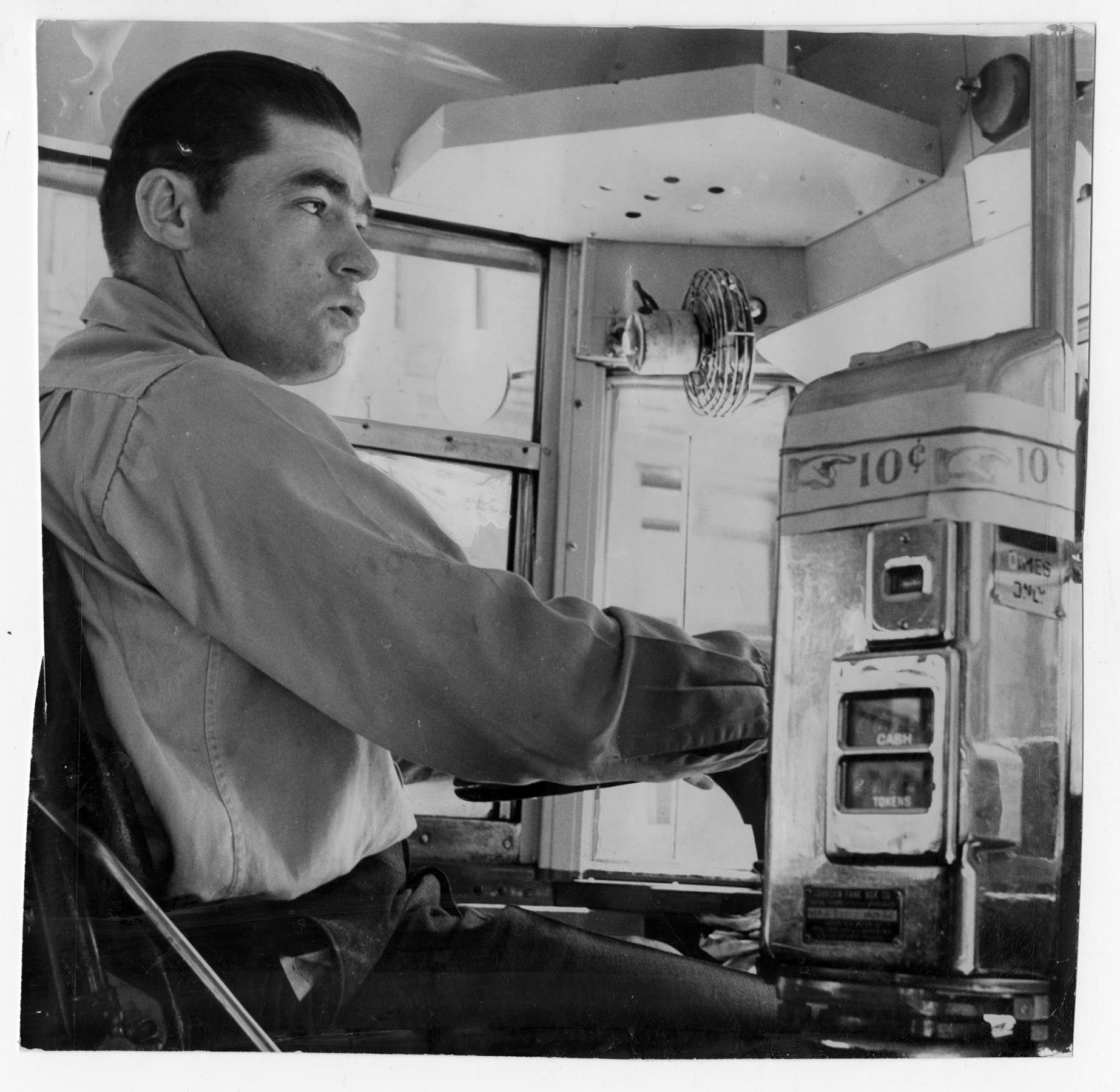 Image of Bus driver D. L. Franklin with new 10 cent fare box, Seattle, June 22, 1947