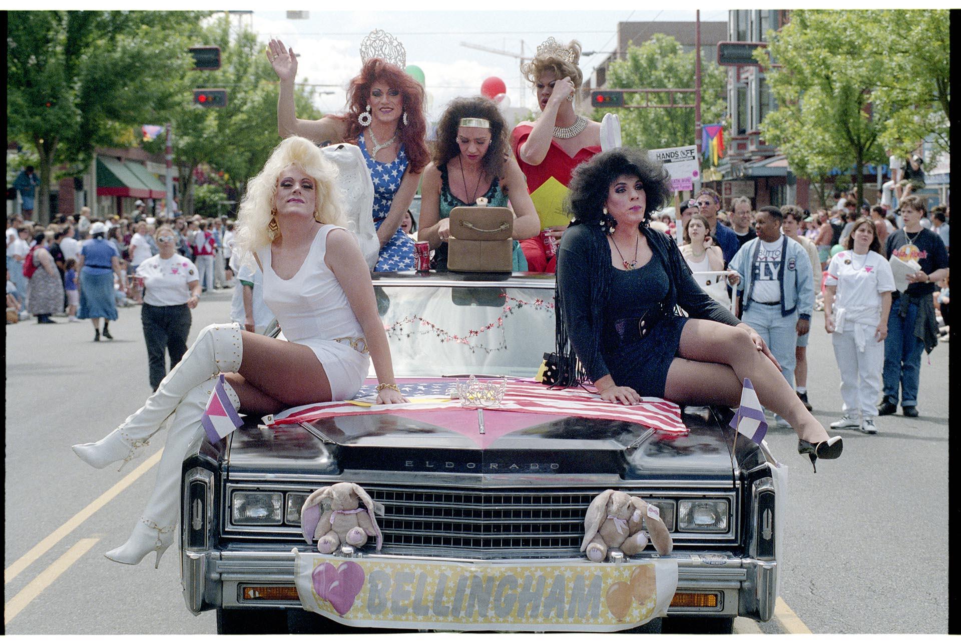 Image of Group posing on car during Pride parade, Seattle, June 27, 1993