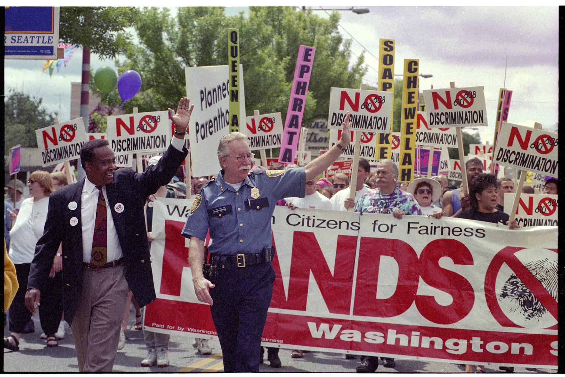 Image of Mayor Norm Rice marching in Pride parade, June 26, 1994