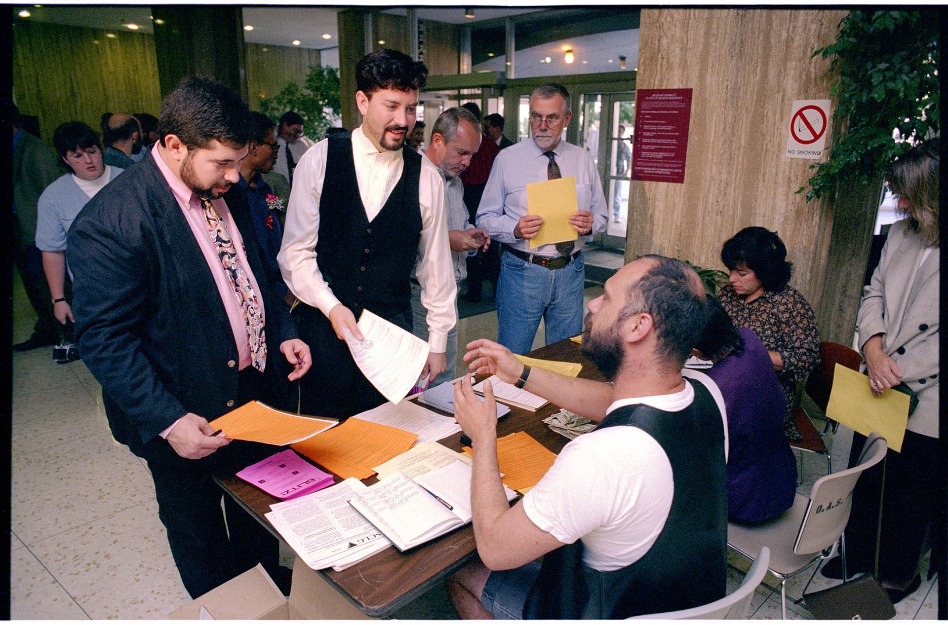 Image of Gay couple registering a domestic partnership at the Municipal Building, Seattle, September 6, 1994