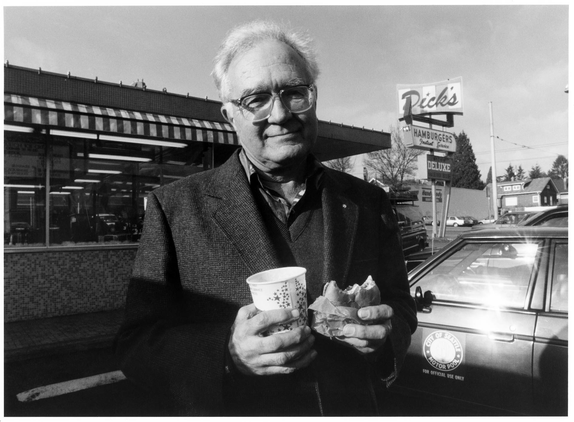 Image of Dick Spady in front of Dick's Drive-In on 45th, Seattle, December 21, 1993