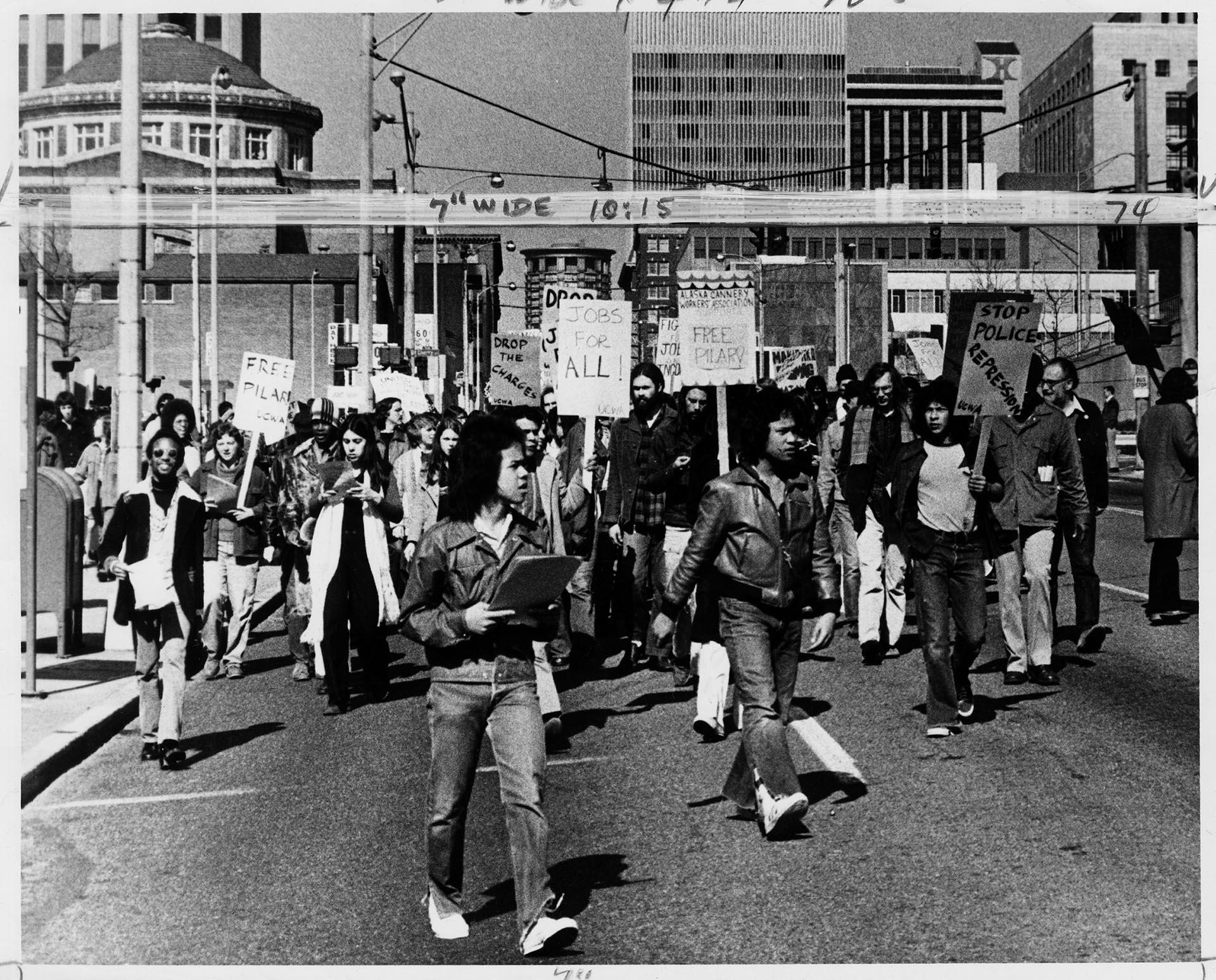 Image of UCWA demonstrators marching down 5th Ave., Seattle, March 11, 1975